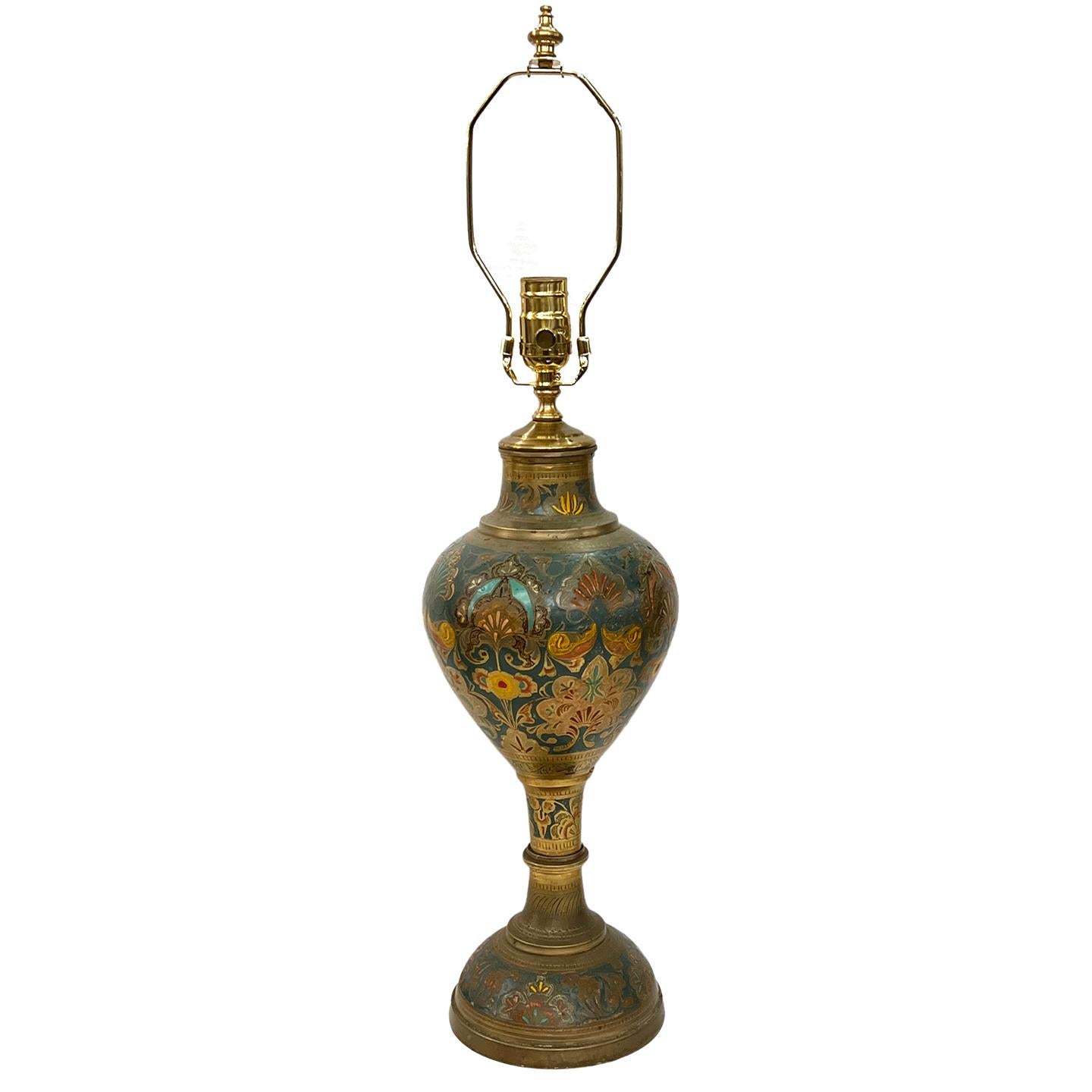 A circa 1920s etched and polychromed middle eastern metal table lamp.

Measurements:
Height of body: 17