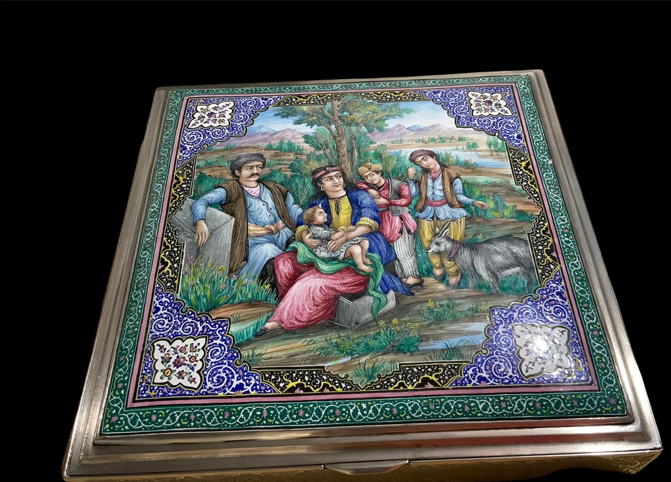 This is a large squared shaped Persian enameled painting silver box. It depicts a scene of a Persian family with the parent seated and their three children in front of a tree at a country side. One of them is holding a goat. In the back, you can see