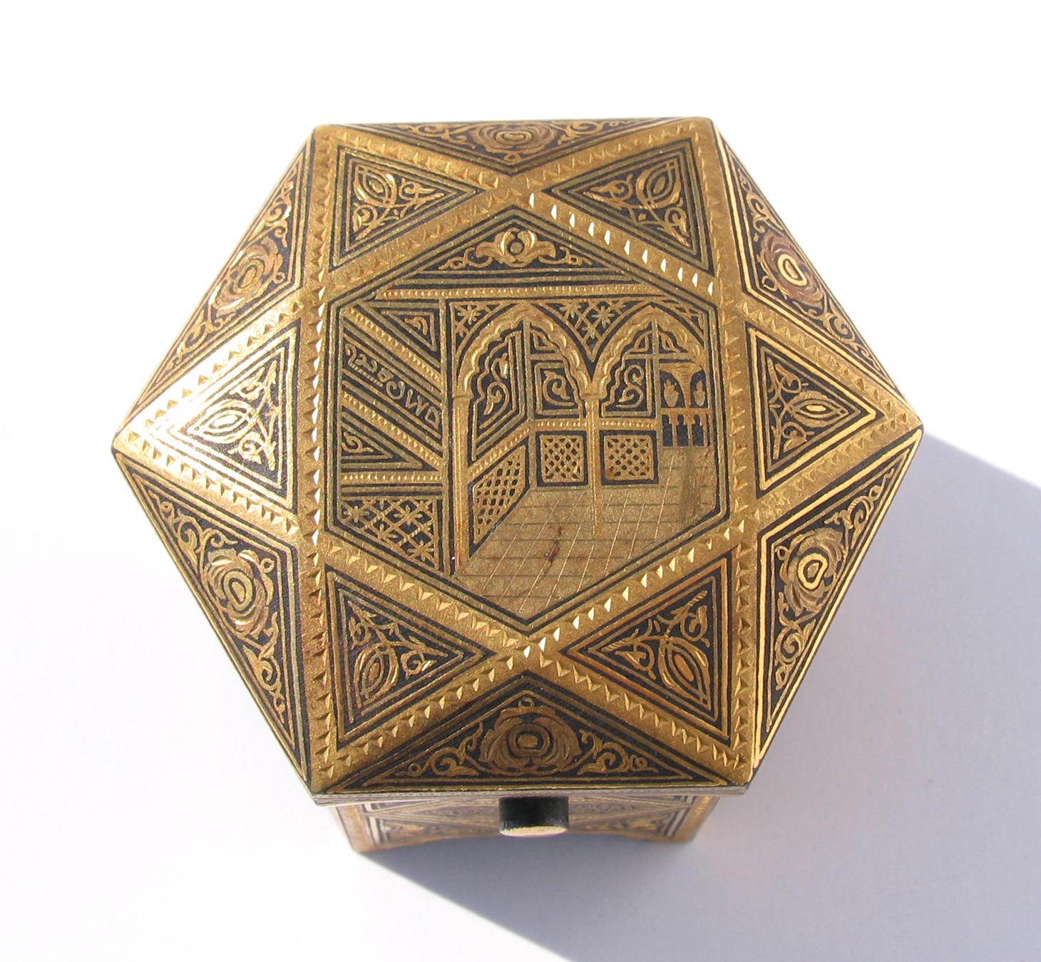 Persian hand engraved brass hexagonal ring box with hinged top, and brass button for opening. Red velvet interior measures 1.75 x 1.5 x .75. Exterior measures 2 inches x 2 inches x 1.75. The perfect ring box!