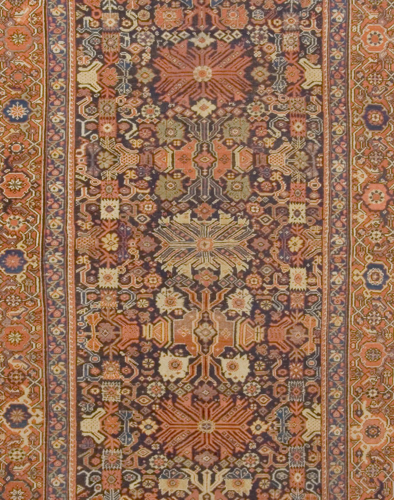 Persian Feraghan rug runner, circa 1880, 6' x 12'8. A lovely hand-knotted antique Feraghan rug. With navy blues and shades of reds. Now in Markazi Province, west Persia, the Feraghan district has woven a variety of styles and textures from good to