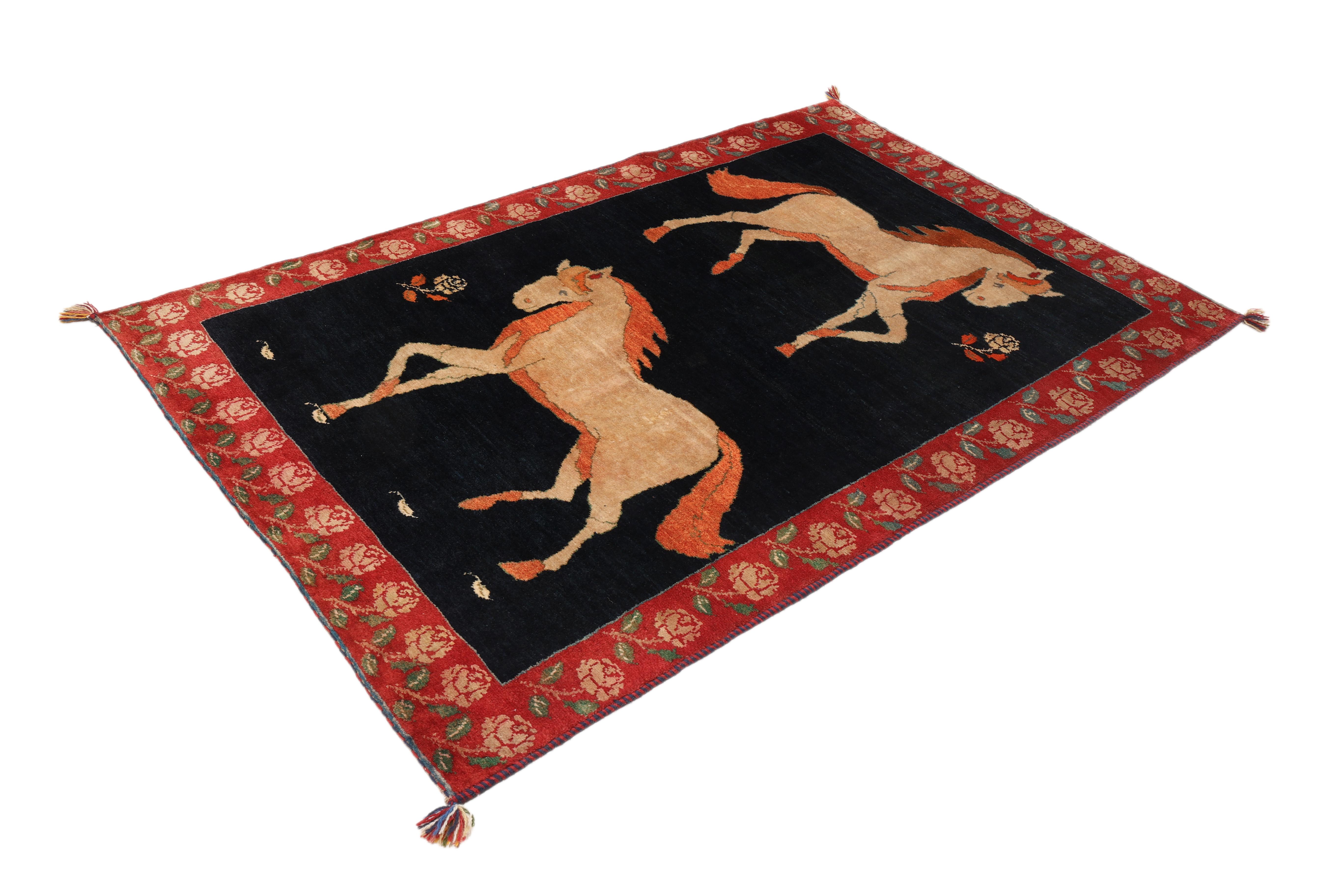 Hand-knotted Persian Gabbeh, crafted in Iran with traditional techniques.

Unique horse motif design – two stylized horses on a dark blue field with a red floral border.

Playful and symbolic imagery, making it both decorative and collectible.

Made
