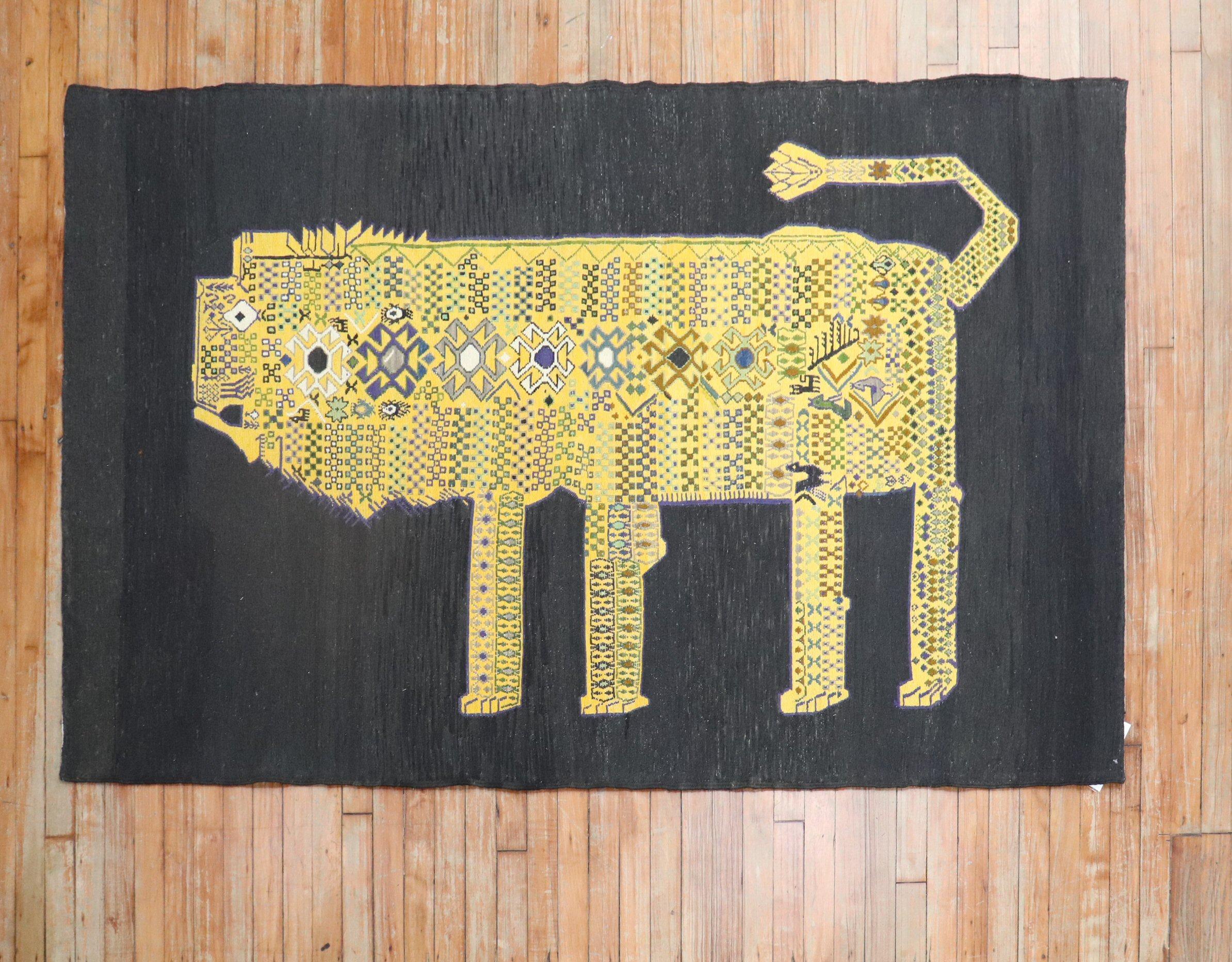 Accent size Persian Kilim from the late 20th century with a yellow lion featuring abstract elements with a gorilla face sitting on a black ground

Measures: 4'2'' x 6'8''

This was originally belonging to a private Persian collector who