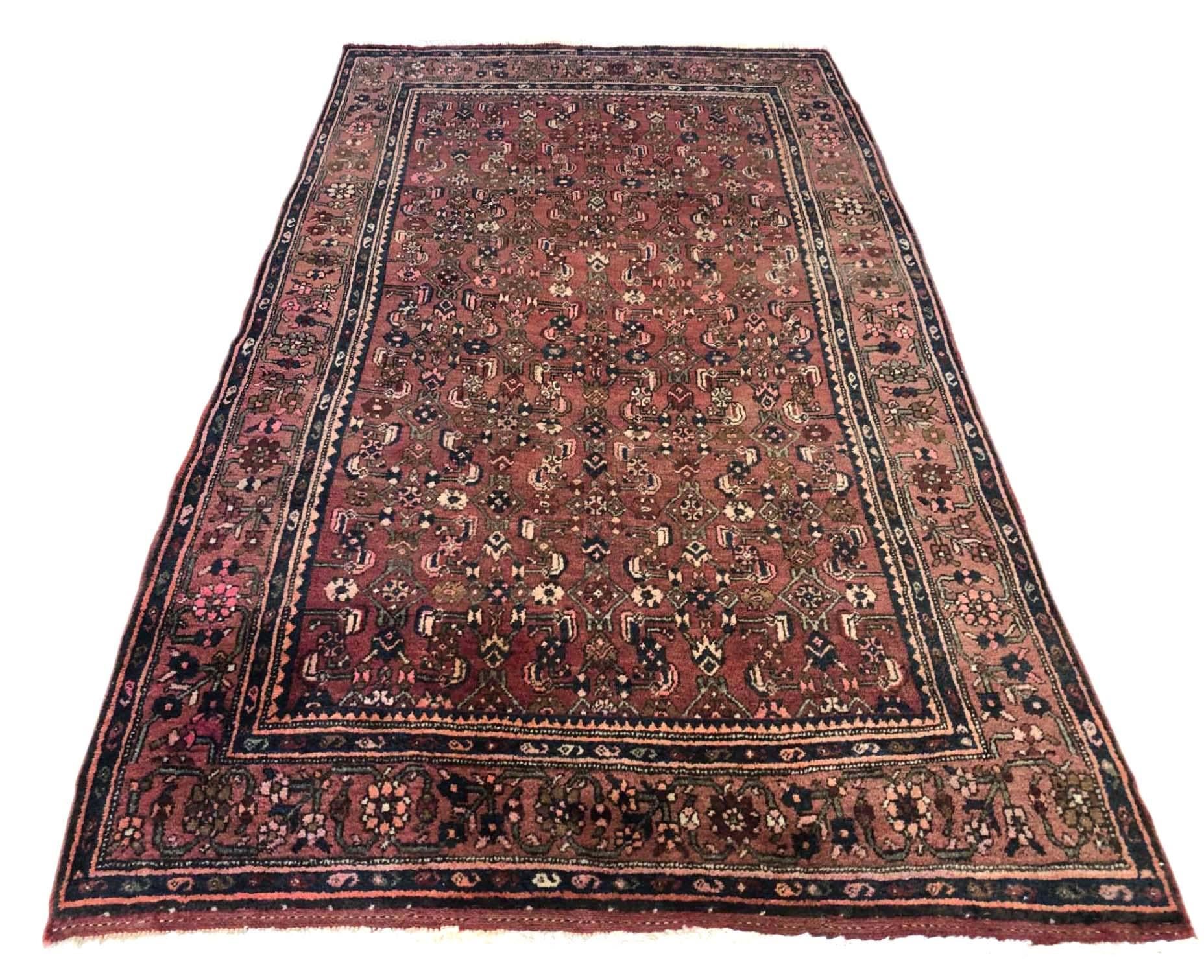 This piece is a handmade Persian Bijar rug. The pile is wool with cotton foundation. This design is all-over fish pattern. Bijar rugs are well-known for their craftsmanship and design. The size is 4 feet 3 inches wide by 7 feet 2 inches tall. This
