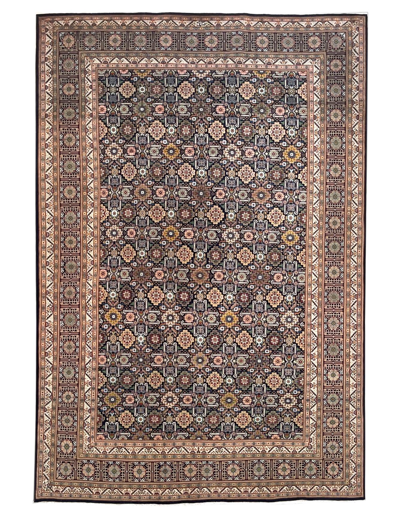 This rug is a hand-knotted Persian Tabriz rug with a great quality. Tabriz is one of the oldest rug weaving centers and makes a huge diversity of types of rugs. This rug features has an allover design known as Ghoba with a very unique and lovely