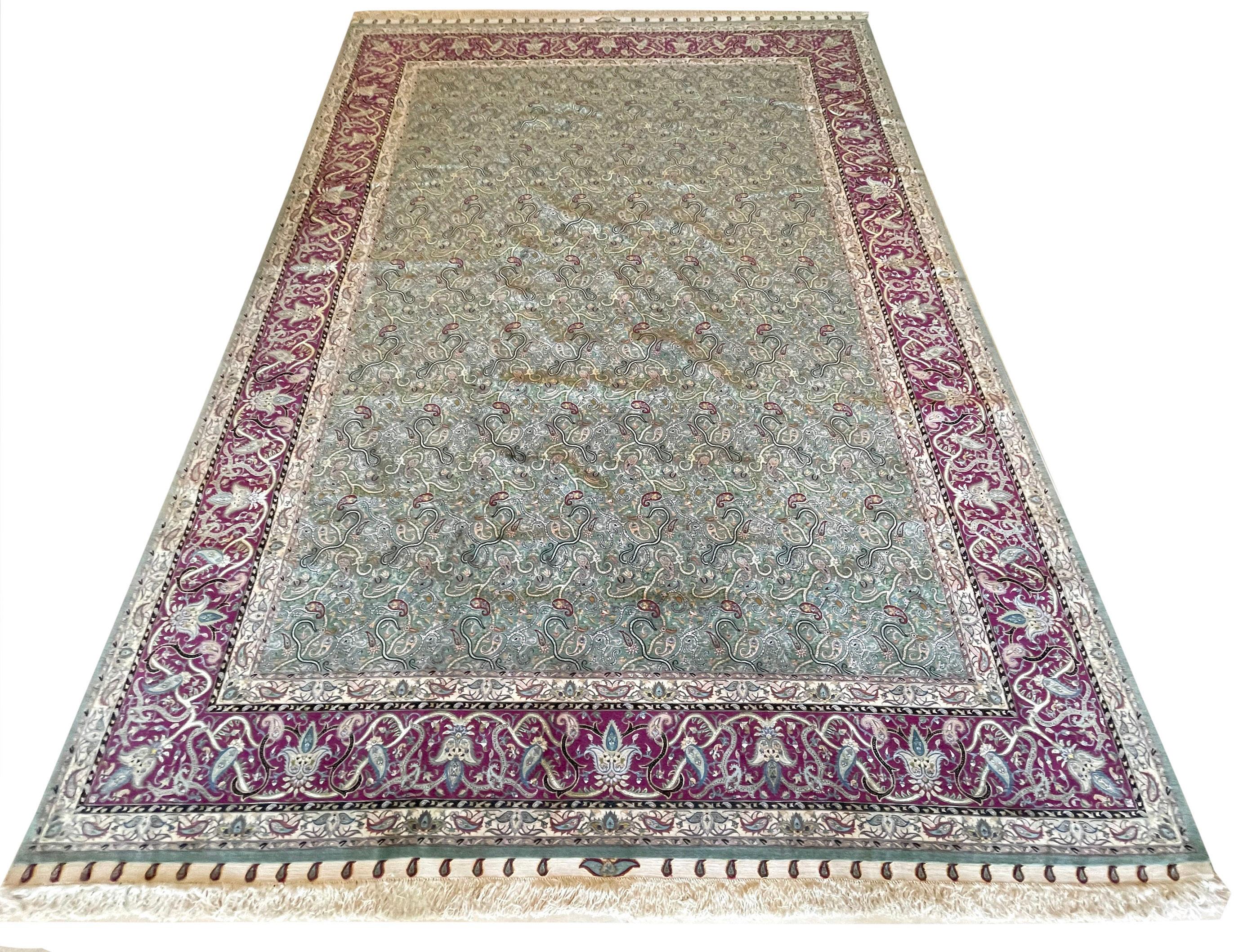 This rug is a hand-knotted master piece Persian Tabriz rug with an extremely fine quality. This rug features an allover paisley pattern and design. The pile is wool and silk on silk foundation. The size is 10 feet wide by 13 feet 4 inches tall. In
