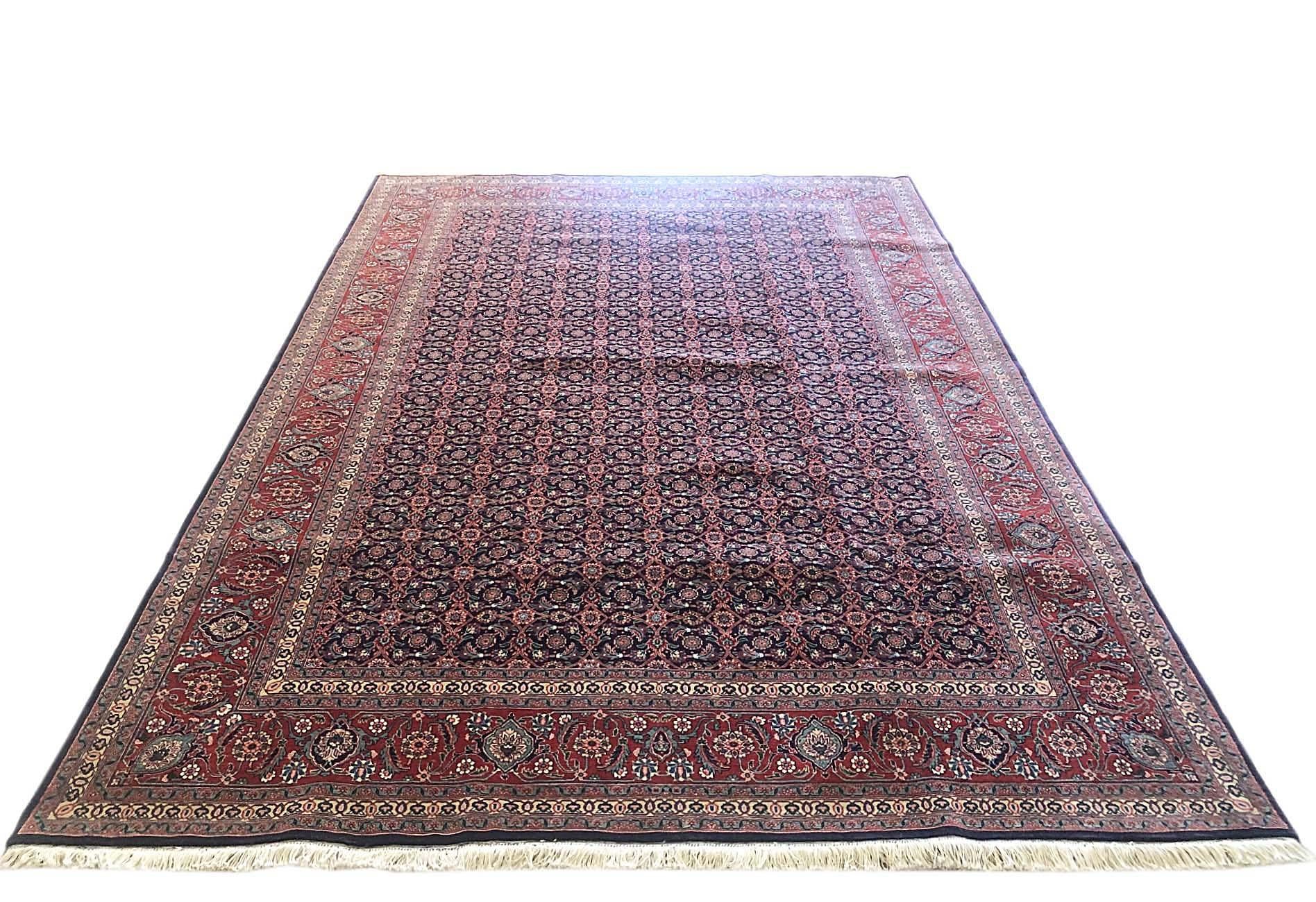 This Persian Tabriz rug has wool and silk pile and cotton foundation. The design is called Herati, this design is quite well known among the different styles of Persian rugs which features an intricate all-over pattern with elegant floral design.