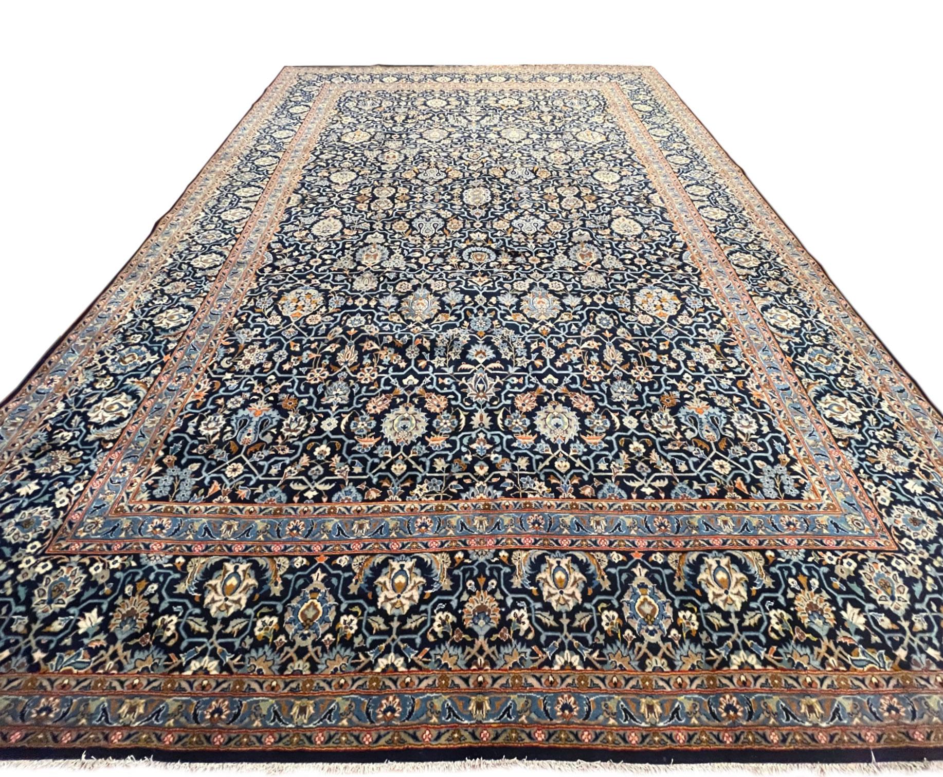 This handmade rug originally from Kashan which are one of the traditional classifications of Persian rugs. The weavers in Kashan produce high quality rugs with high standards of design and technique. This piece has wool pile with cotton foundation.