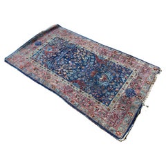 Tapis persan en soie bleu/rouge à motifs floraux, noué à la main, sur toute sa surface