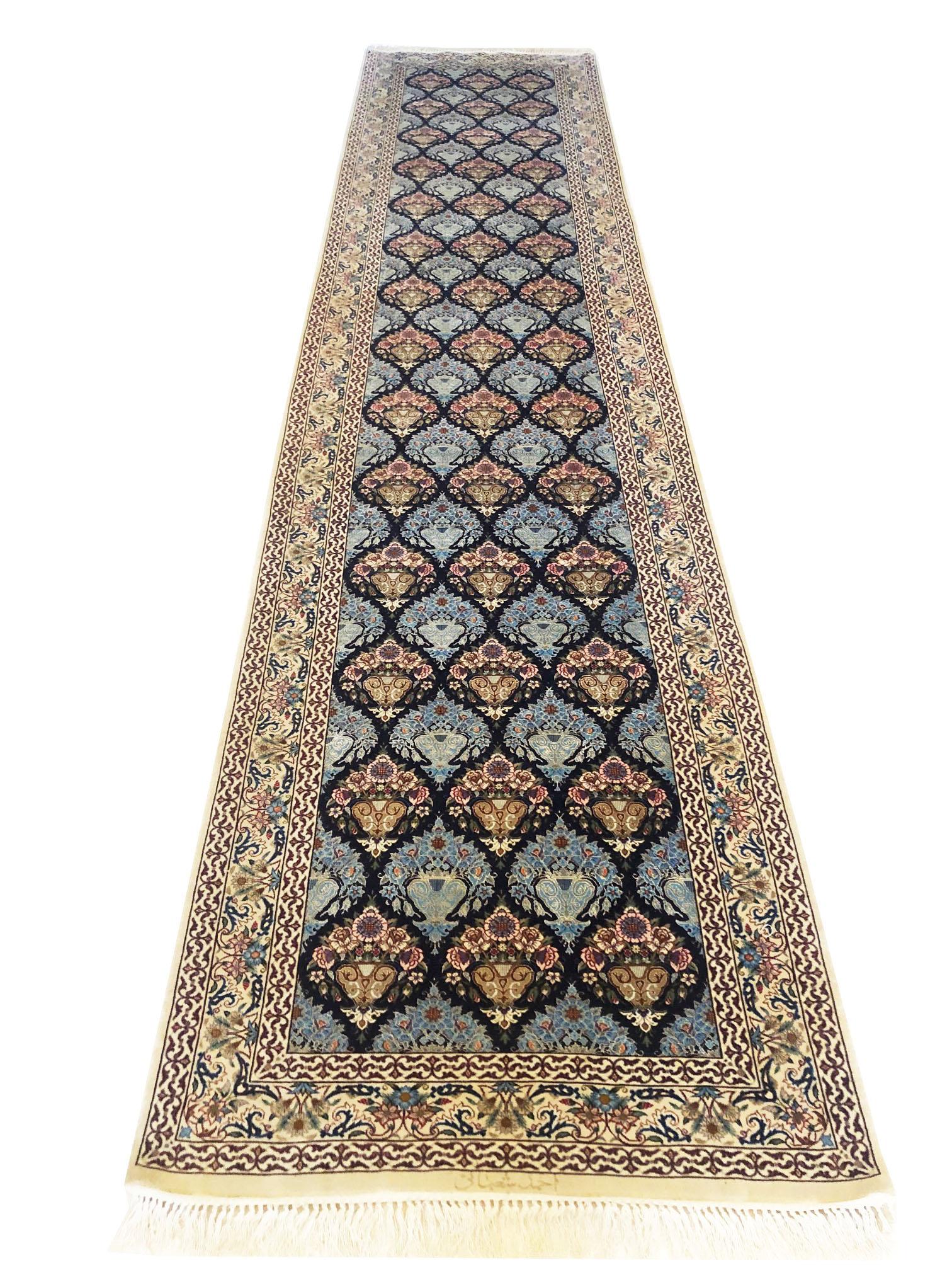 This authentic Persian Isfahan rug has wool and silk pile on silk foundation is a stunning example of the all-over floral vase design rug. The beauty of this magnificent piece is most noticeable in its quality and color combination. This rug has