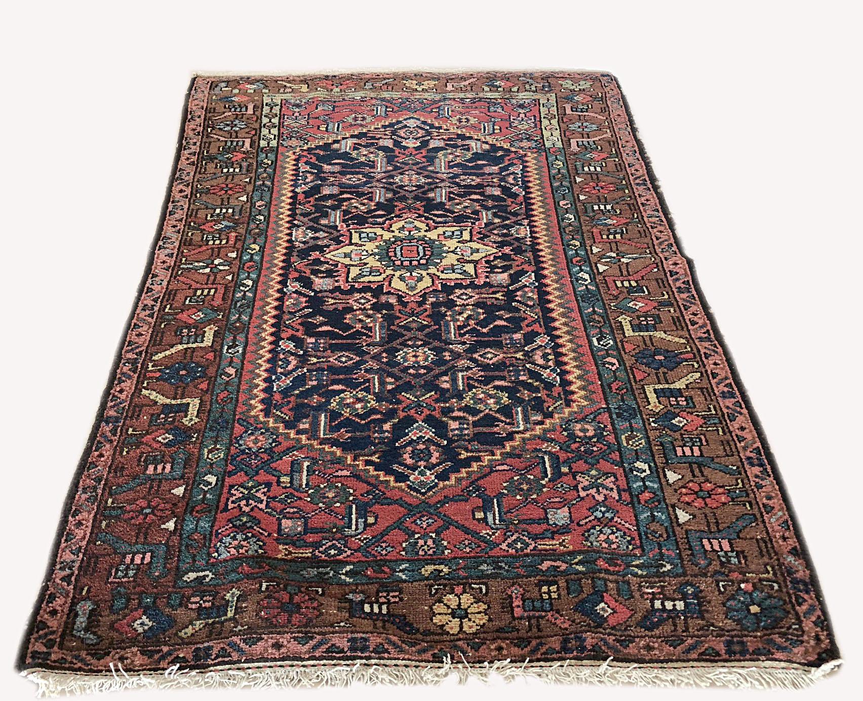 Hamadan is one of the oldest cities in Iran (Persia) that produces fine hand knotted rugs. The colors in this piece are dominated by different nuances of indigo blue, mauve, ivory and brown. The age of this rug goes back to 1930s which makes it a
