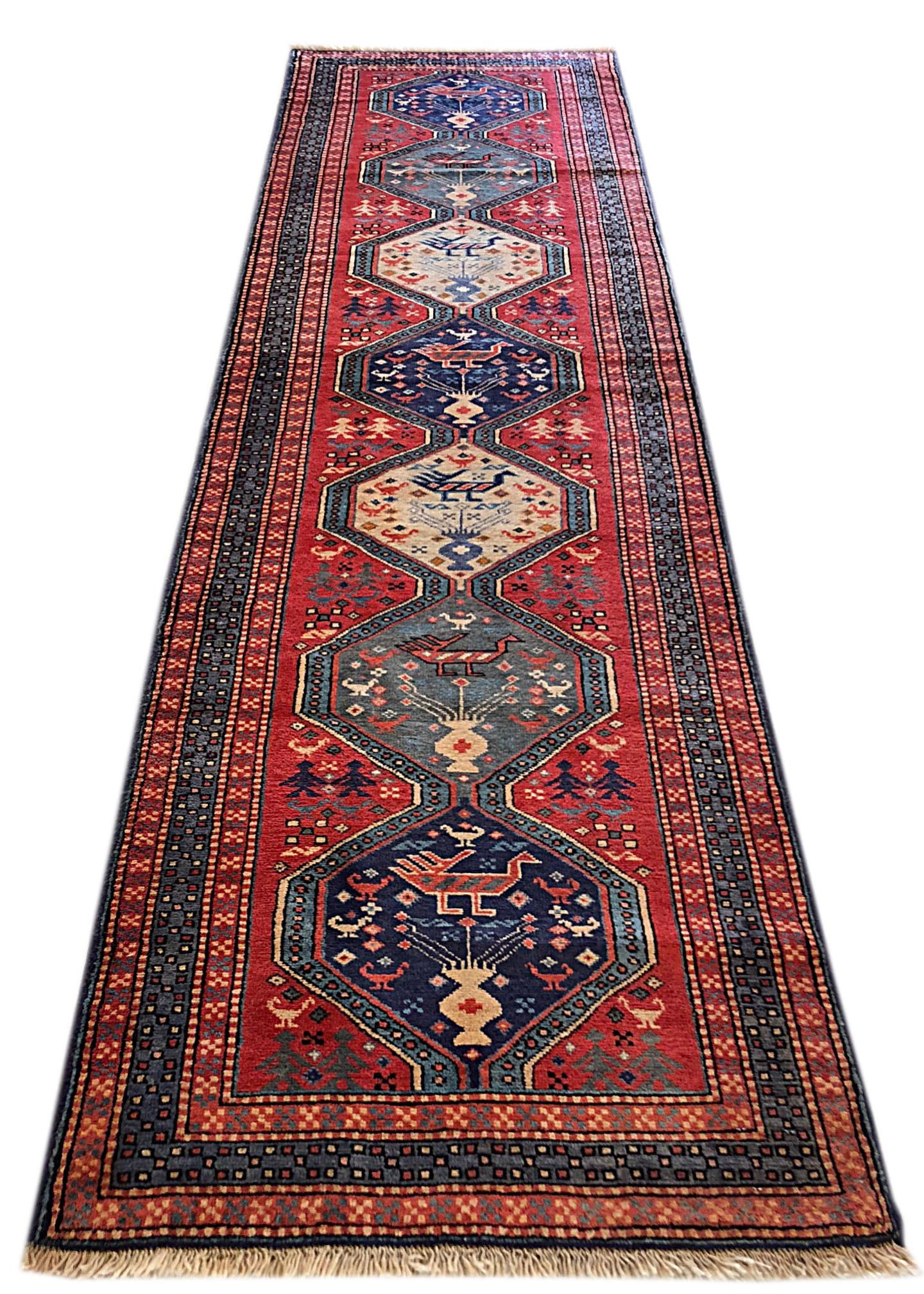This runner is knotted in the province of Azarbayjan in North West of Iran. This beautiful piece has repeated medallion of geometric birds and flowers motifs. The design and color combination can be fitted in any Spanish, Tuscan and modern style.