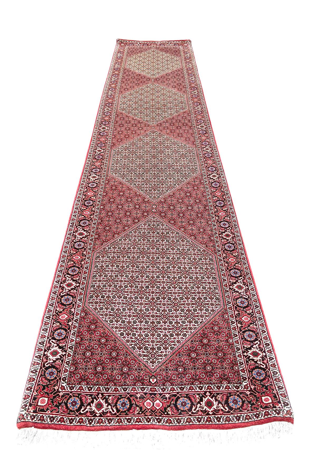 This Authentic beautiful Bijar runner has wool pile and cotton foundation. It is made using high-quality wool, and the knots are beaten down using a heavy metal comb to give a tight, dirt-resistant pile. This stunning Persian Bijar (Tukan) rug is