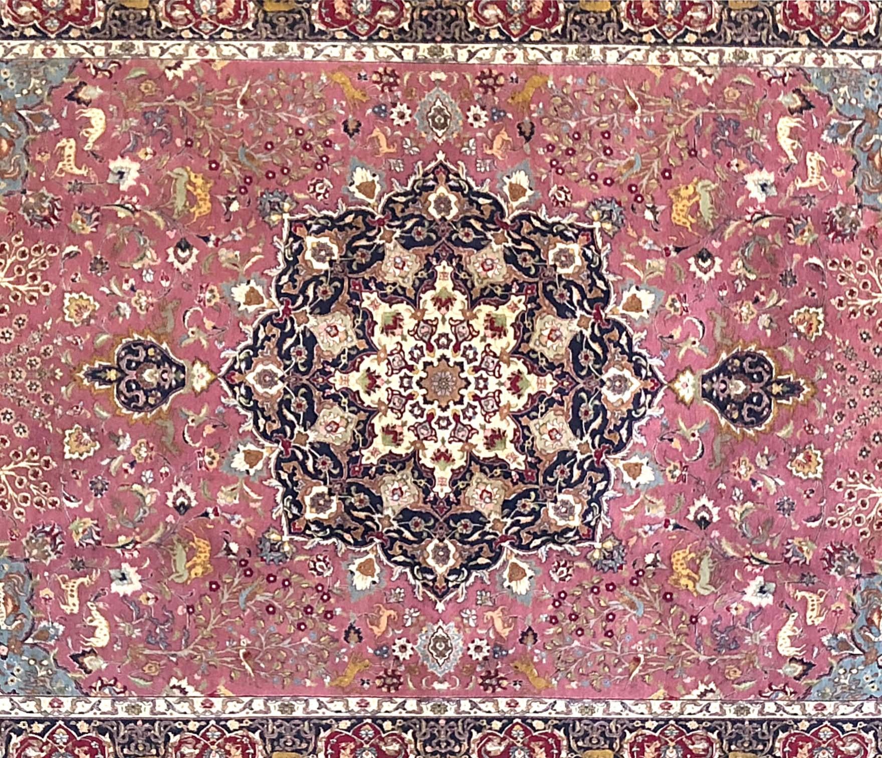 This piece is a hand knotted Persian Tabriz rug with animal motif and floral design. The pile is wool and silk with silk foundation. The size is 6 feet 7 inches wide by feet 10 feet 4 inches tall. This rug is a brand new rug with a 60 “RAJ”