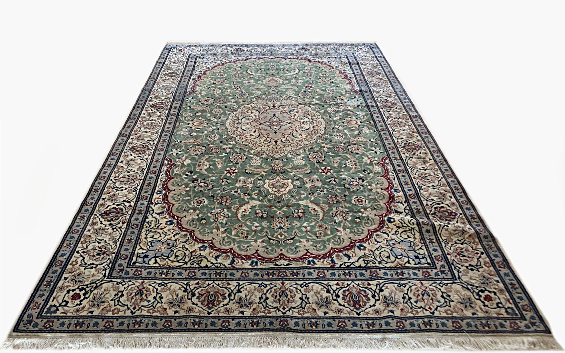 Persian authentic hand-knotted Nain rug with wool pile and cotton foundation. The design is medallion floral. The base color is green with cream border color. Size is 6Ft 7