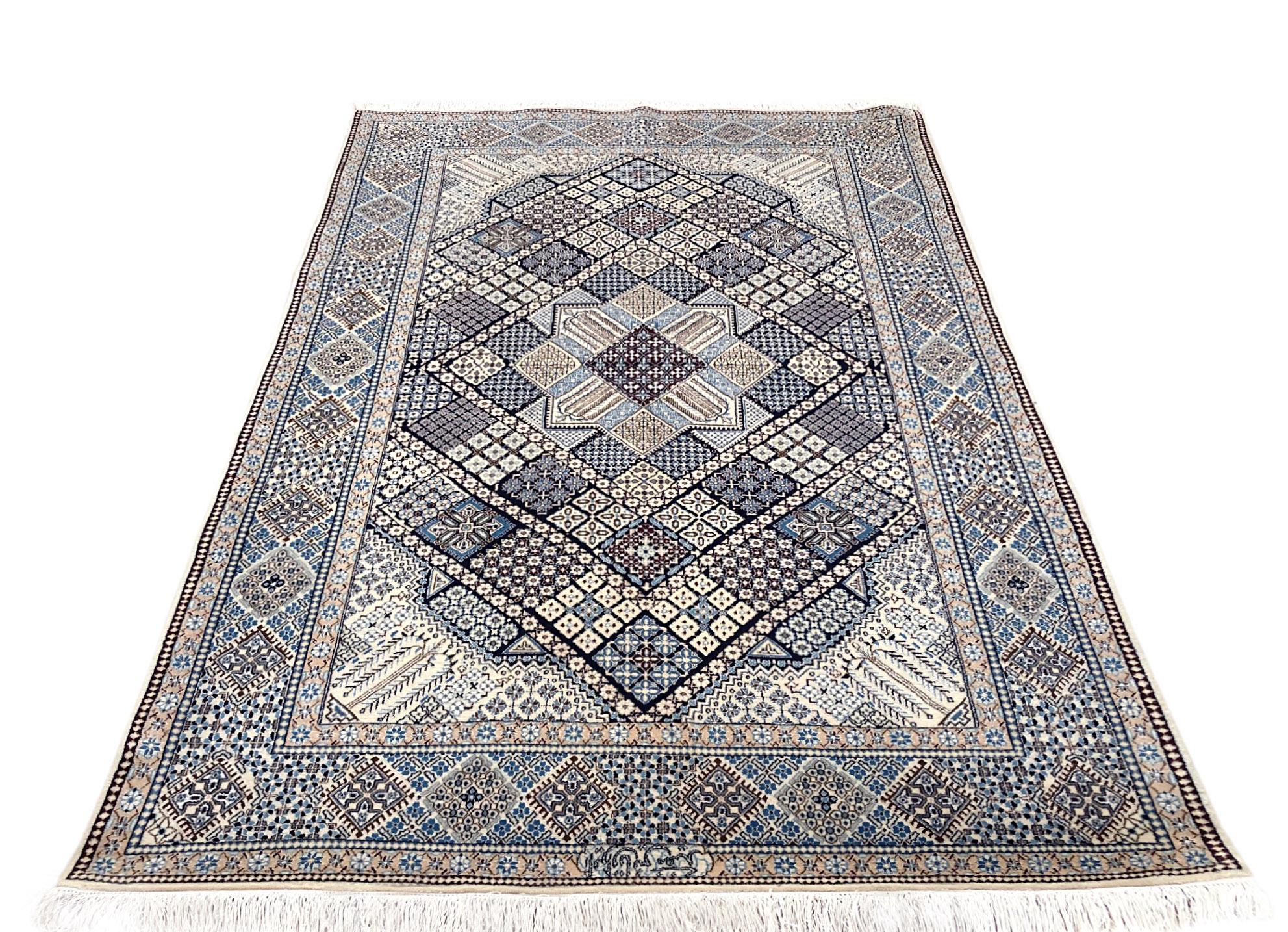 This authentic Persian handmade Nain (6 LA) rug has wool and silk pile with cotton foundation. Nain is a city in Iran that is well known for producing Fine handmade rug. This beautiful rug is from Iran, Nain and the design is diamond print. The base