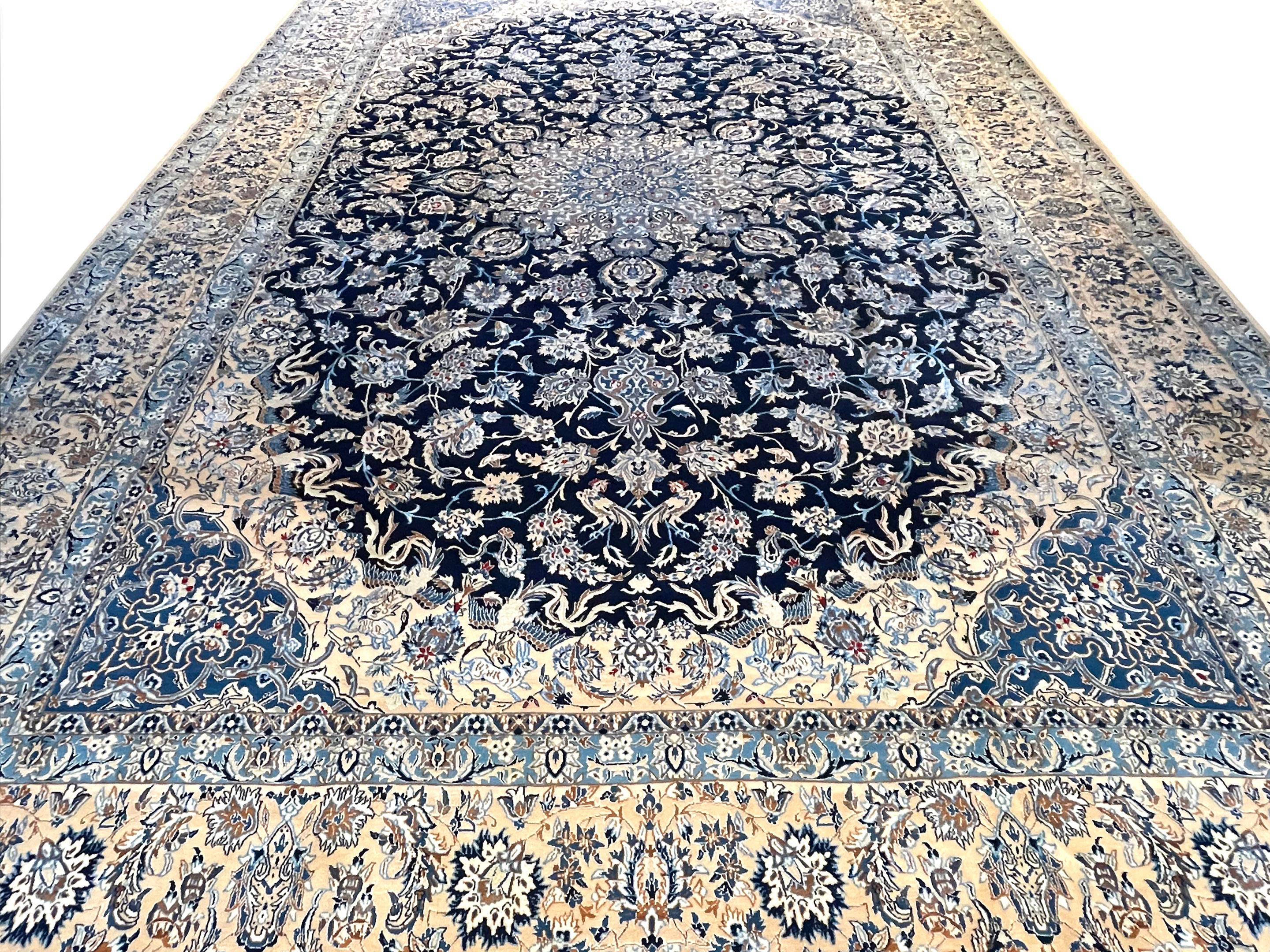 This authentic Persian round hand-made Nain 9 LAA has high quality wool and silk pile with cotton foundation, which silk highlights the detail in the design and it has signed by Habibian. (Each thread of the warp is made up of three threads, which