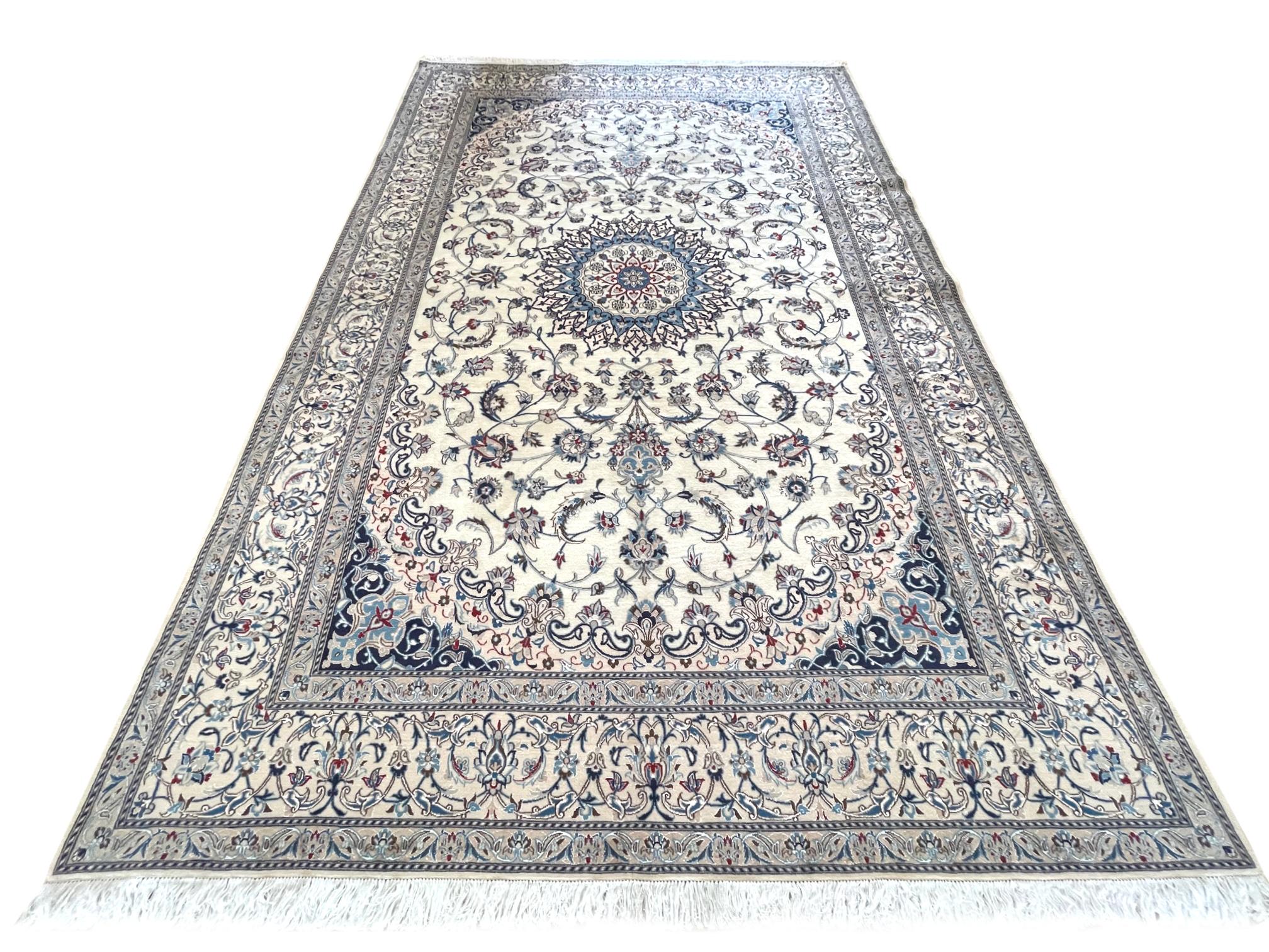 This authentic Persian round hand-made Nain 9 LAA has high quality wool and silk pile with cotton foundation. (Each thread of the warp is made up of three threads, which you have 3x3=9 making it a 9 LAA Nain, equivalent to about 250 knots per square