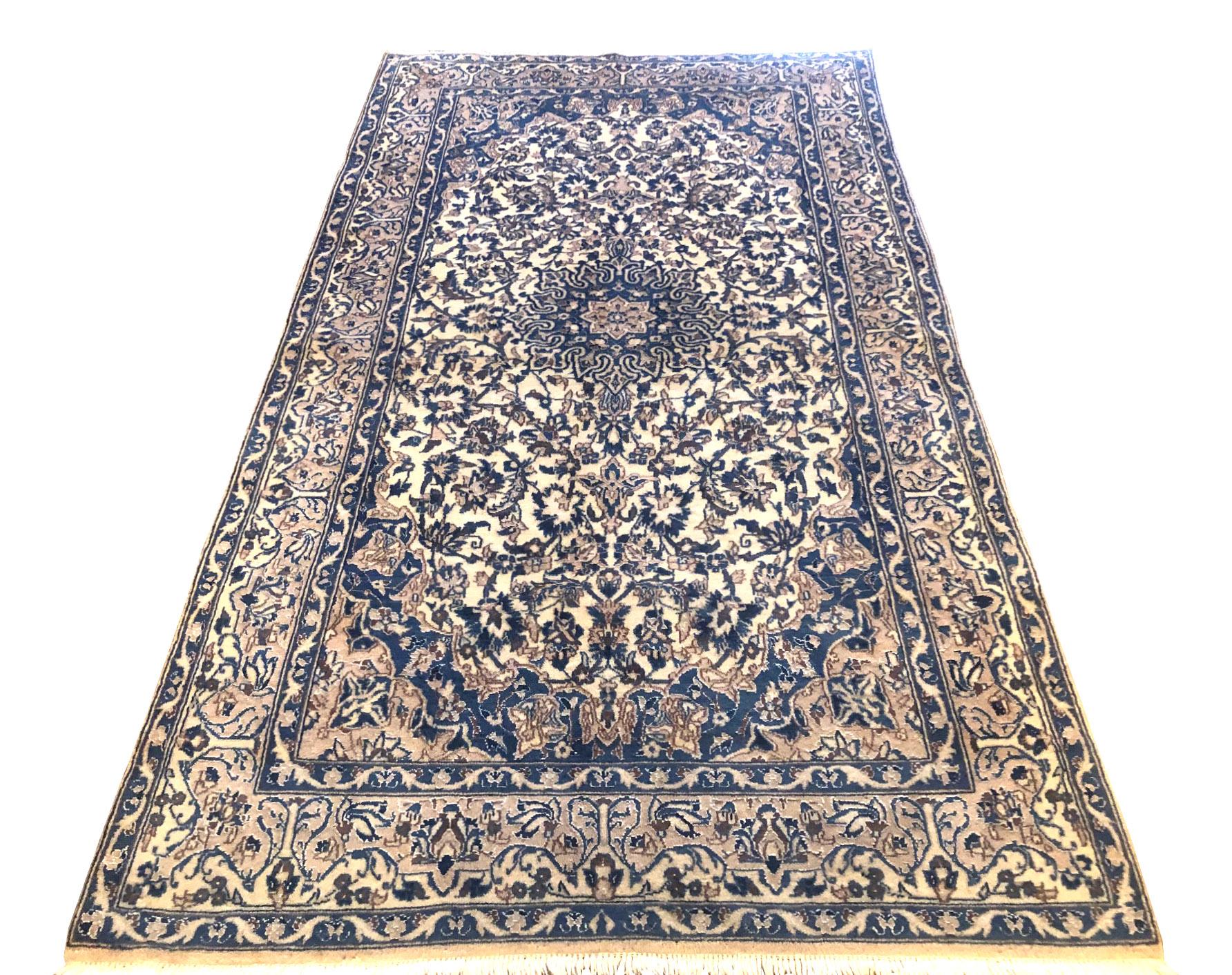 This authentic Persian handmade Nain (9 LA) rug has wool and silk pile with cotton foundation. Nain is a city in Iran that is well known for producing fine handmade rug. Nain rugs have a high reputation and are very popular. The size is 3 feet 8