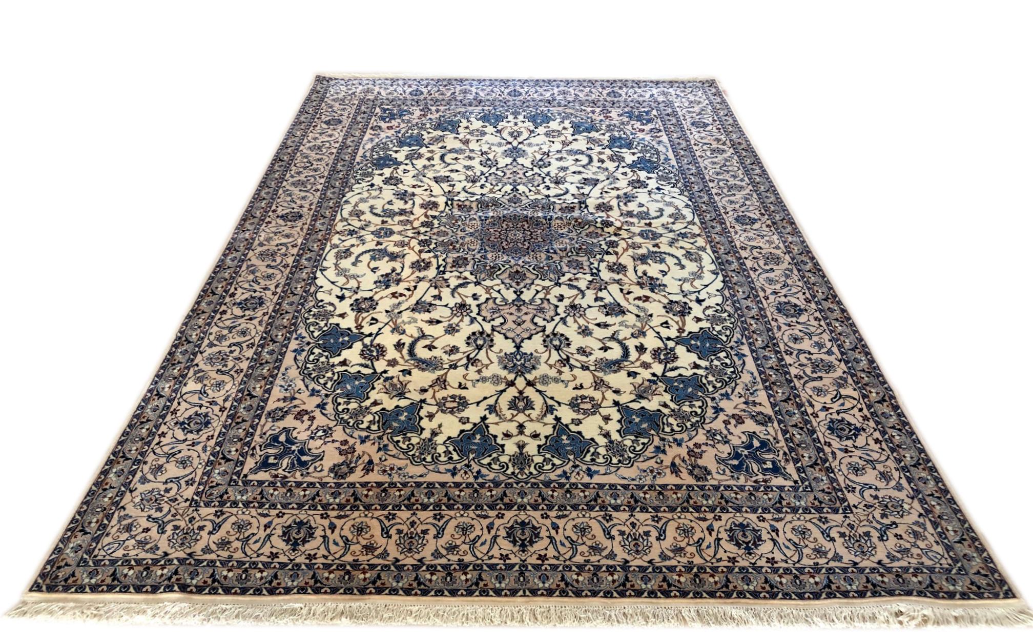 This authentic Persian handmade Nain (6 LA) rug has wool and silk pile with cotton foundation. Nain is a city in Iran that is well known for producing fine handmade rug. This beautiful rug is from Iran, Nain and the design is floral medallion. The