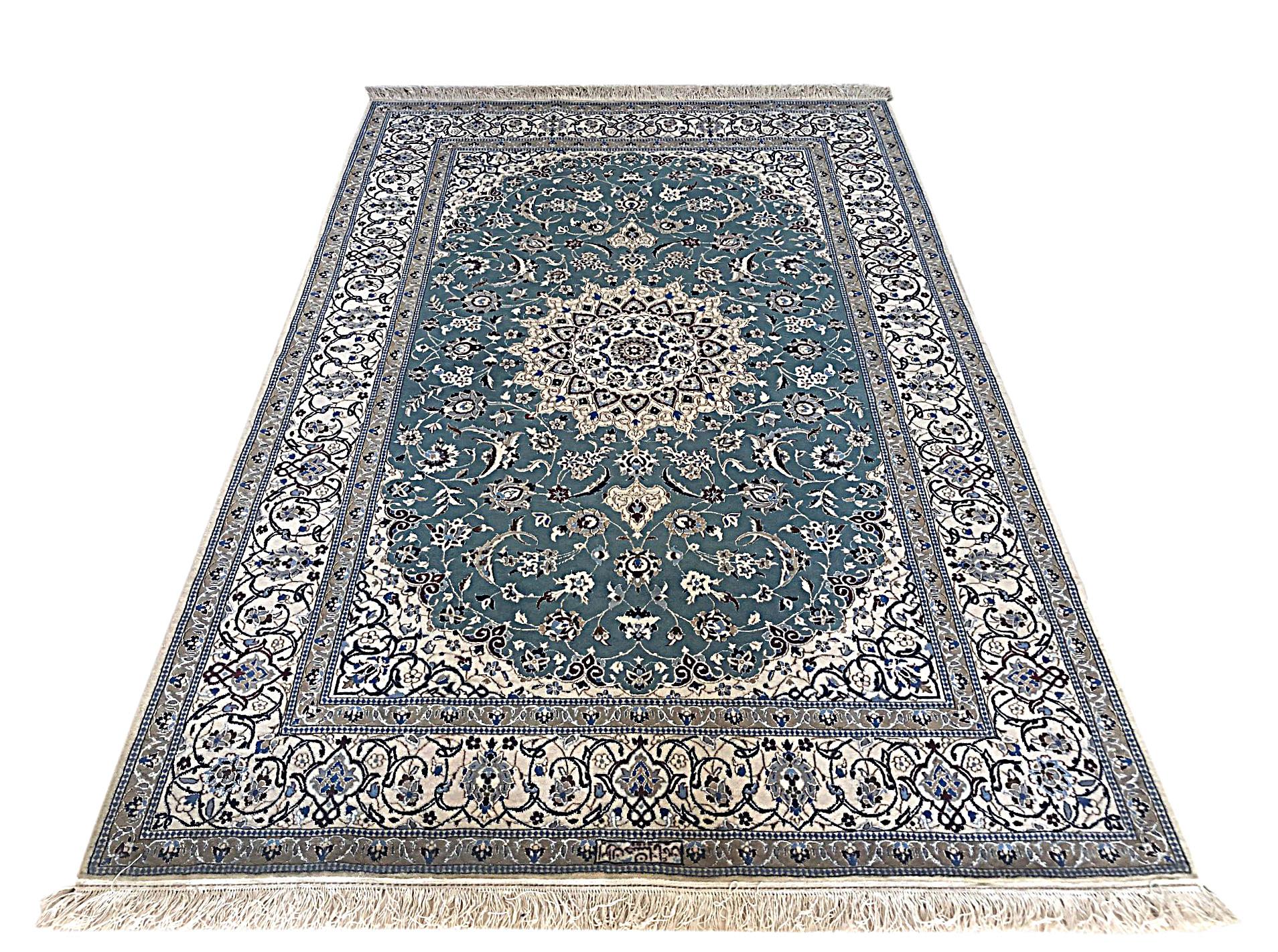 This authentic Persian handmade Nain (6 LA) rug has wool and silk pile with cotton foundation. Nain is a city in Iran that is well known for producing fine handmade rug. Nain rugs have a high reputation and are very popular. This beautiful rug has