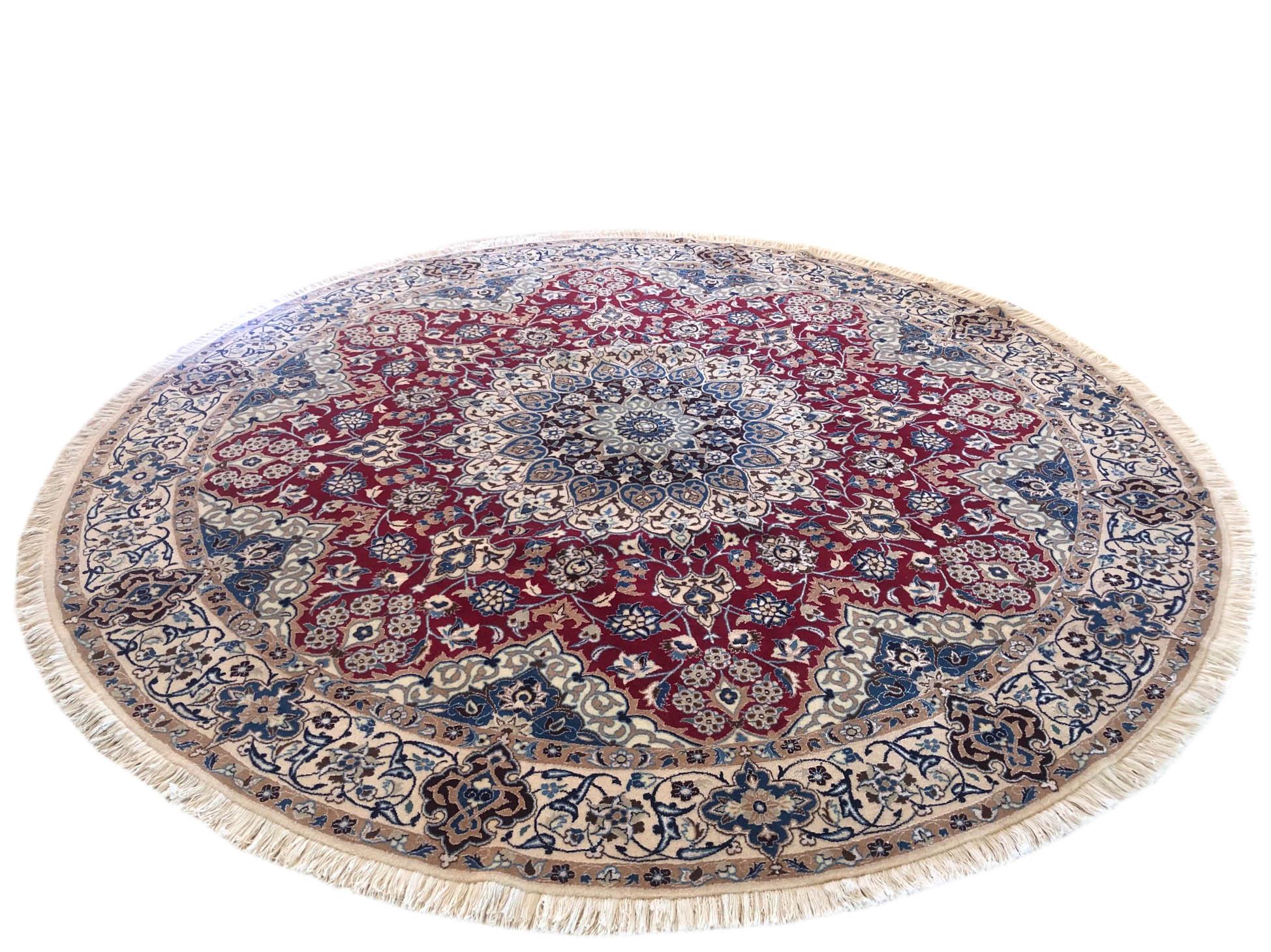 This authentic Persian round handmade Nain (9 LA) rug has wool and silk pile with cotton foundation. Nain is a city in Iran that is well known for producing fine handmade rug. This rug has medallion floral design. The base color is red and border