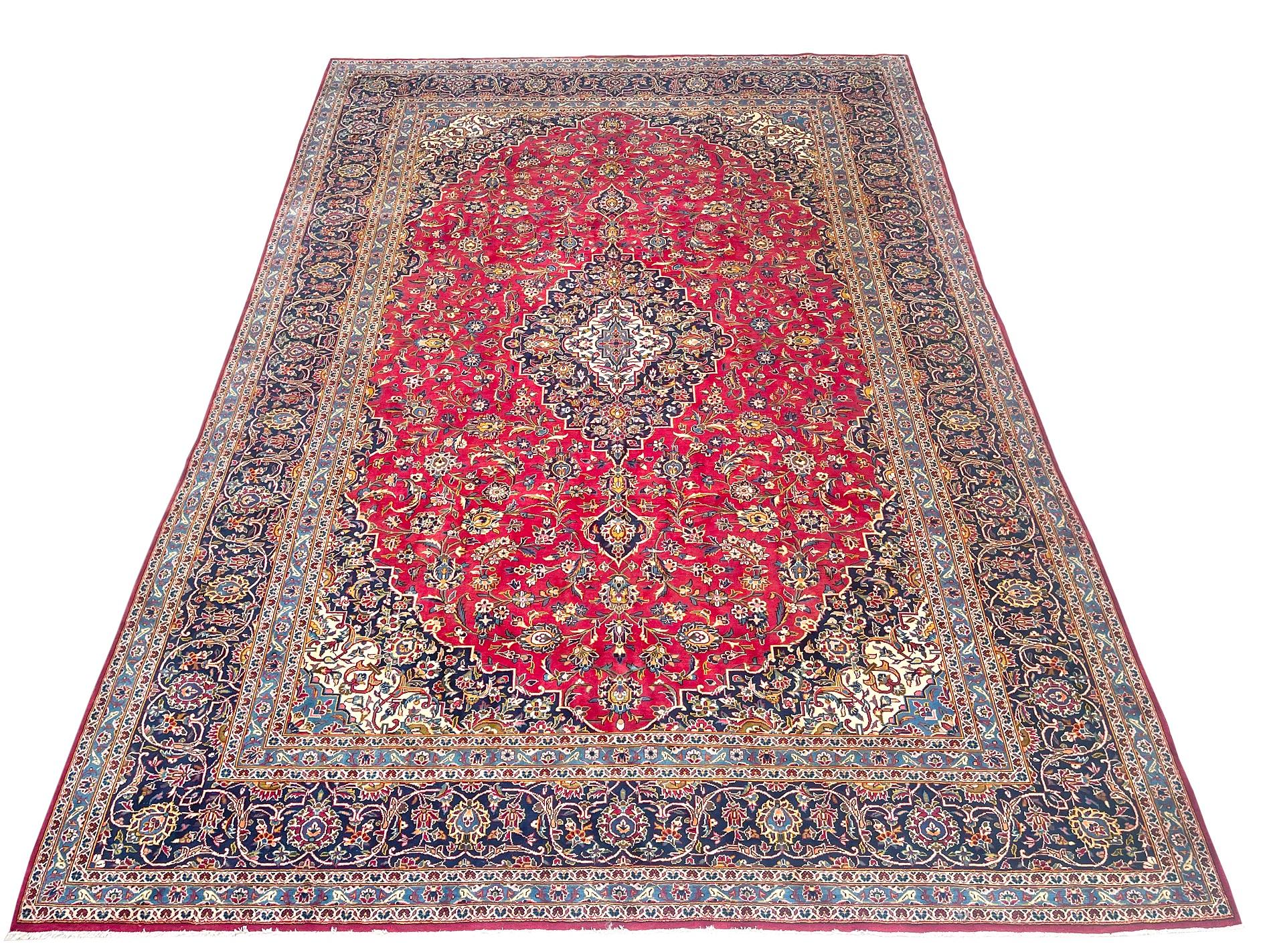 This handmade rug originally from Kashan which are one of the traditional classifications of Persian rugs. This piece has wool pile with cotton foundation. The design is medallion floral design with great tensile strength and resistance. The size of