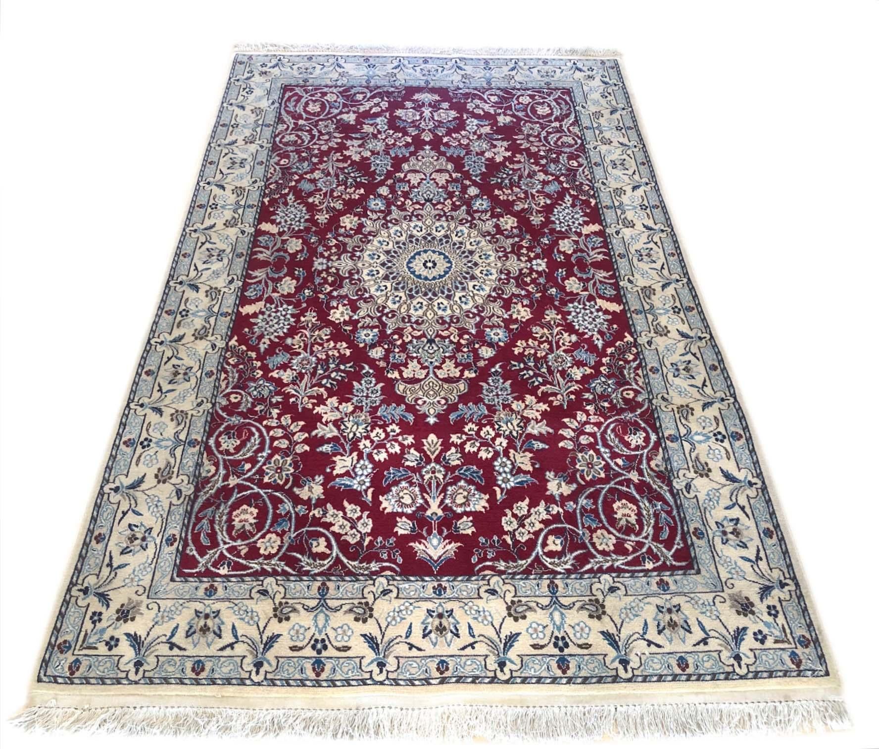This authentic Persian handmade Nain rug has wool and silk pile with cotton foundation. Nain is a city in Iran that is well known for producing Fine handmade rug. This beautiful rug is from Iran, Nain and the design is floral medallion. The base