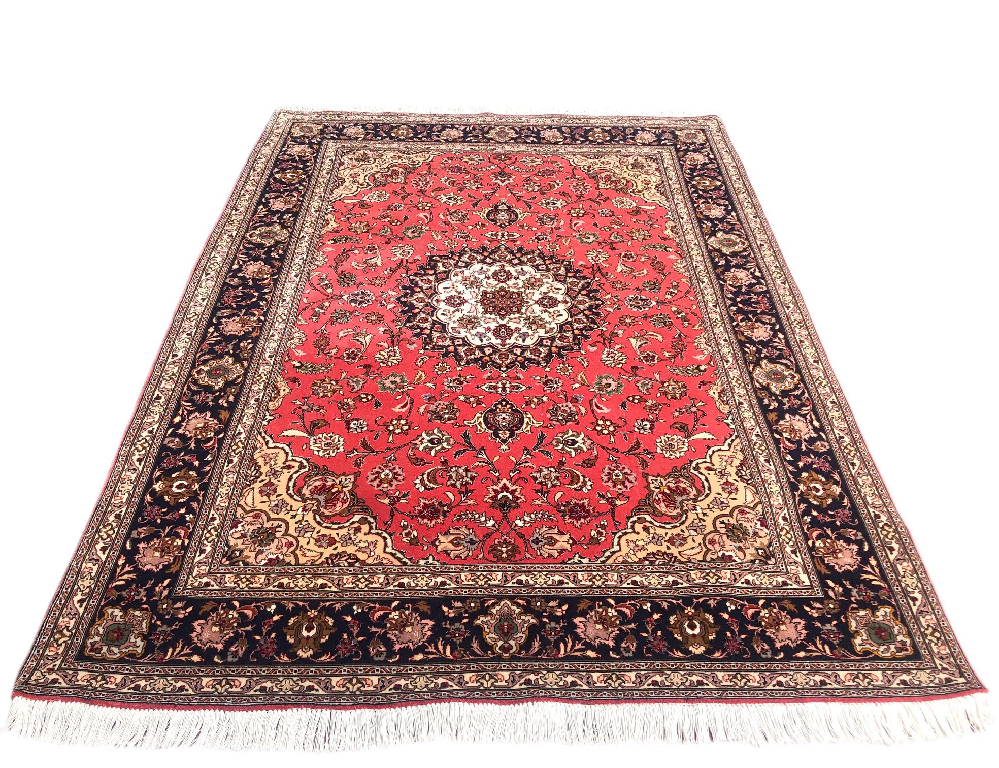 This rug is a hand knotted Persian Tabriz rug with a wool and silk pile on cotton foundation. Tabriz is one of the oldest rug weaving centers and makes a huge diversity of types of rugs. This rug features a floral medallion pattern and the design is