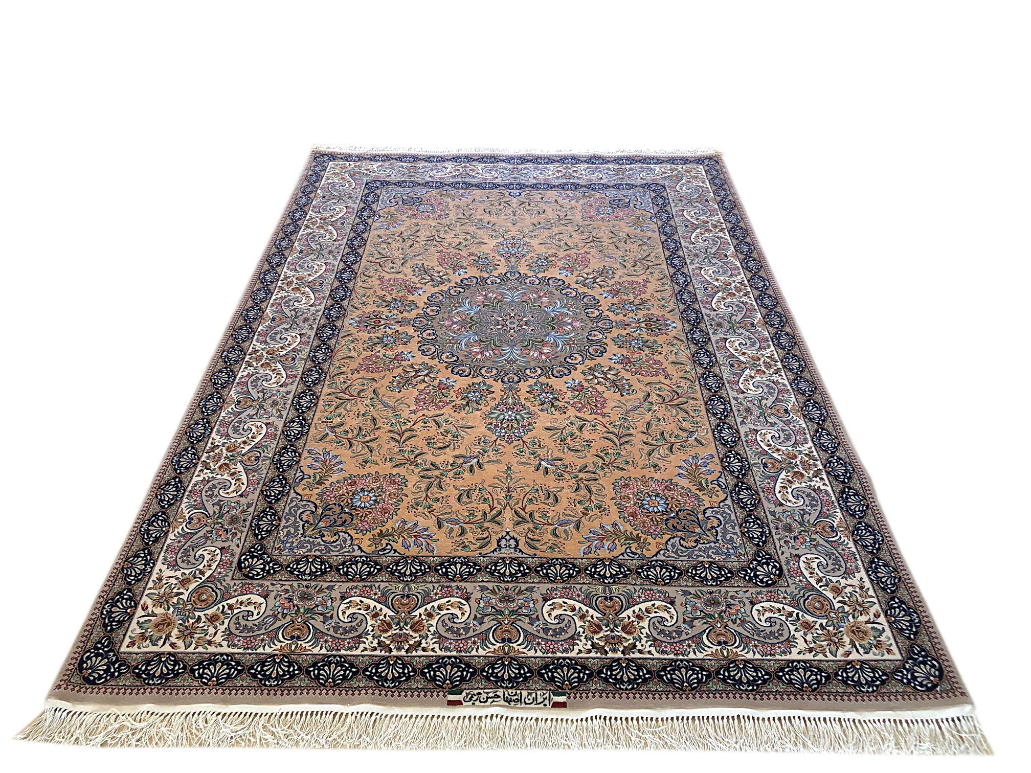 This authentic Persian Isfahan rug has wool and silk pile on silk foundation is a stunning example if the medallion floral rug. The beauty of this magnificent piece is most noticeable in its quality and color combination. This rug has signed by