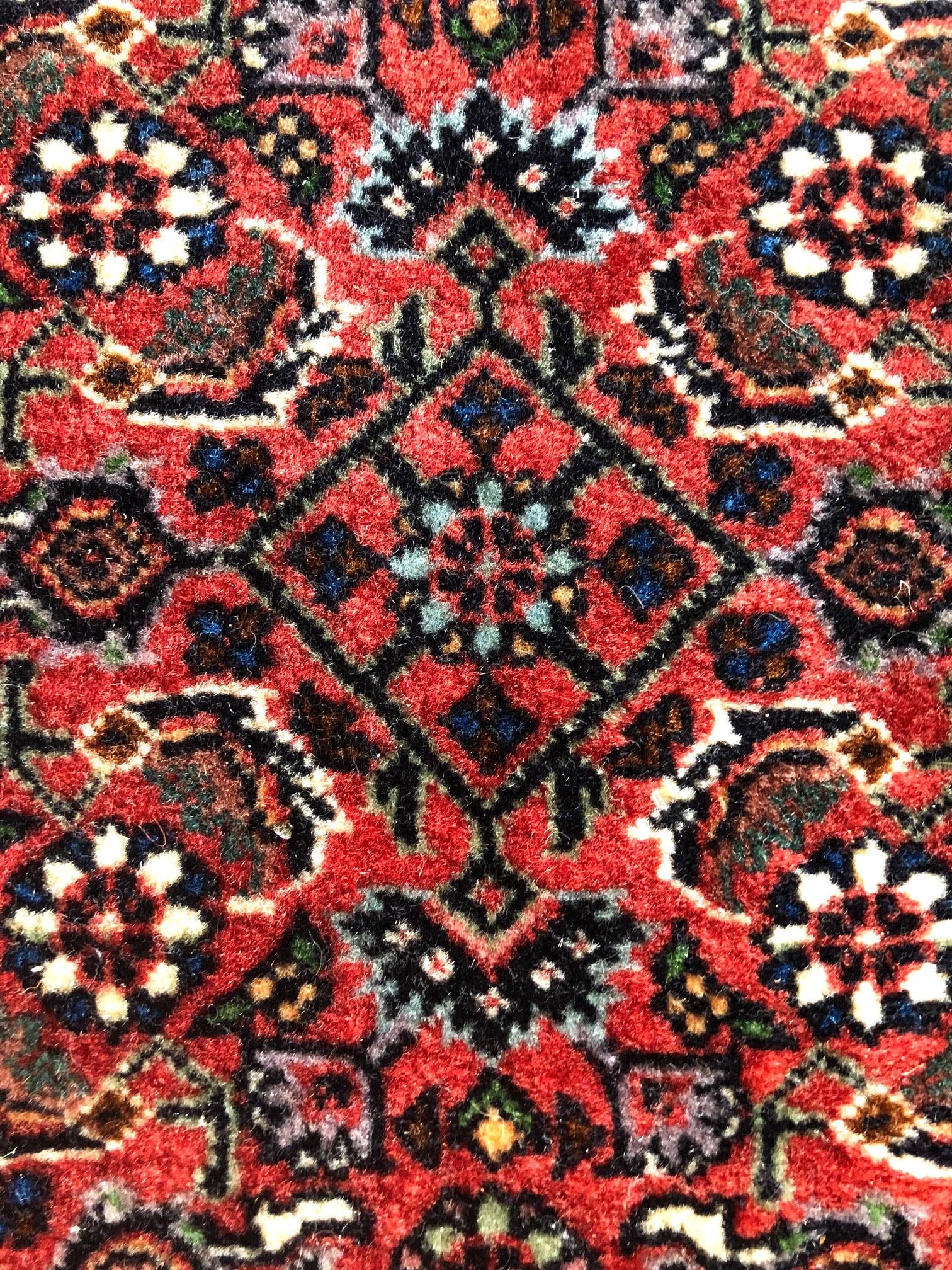 This piece is a handmade Persian rug. The pile is wool with cotton foundation, the pile is incredible dense and strong. This stunning Persian Bijar (Bukan) rug is among the most hardwearing rug. It is made using high-quality wool, and the knots are