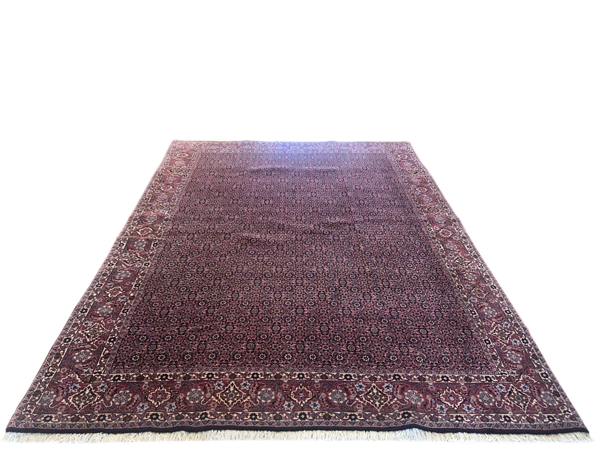 This piece is a handmade Persian rug. The pile is wool with cotton foundation, the pile is incredible dense and strong. This stunning Persian Bijar rug is among the most hardwearing rug. It is made using high-quality wool, and the knots are beaten