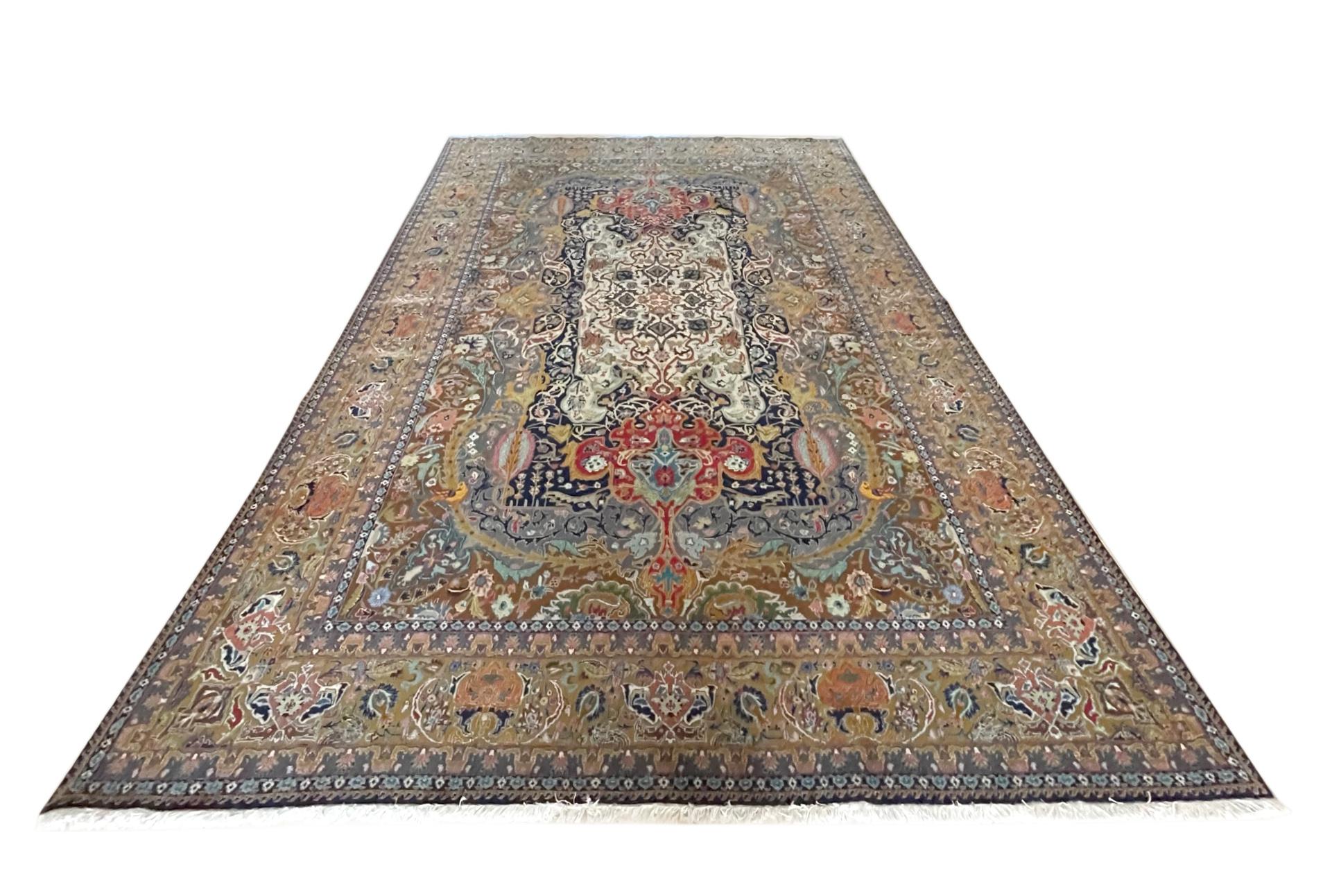 This rug is a hand knotted master piece Persian Tabriz rug with a great quality. Tabriz is one of the oldest rug weaving centers and makes a huge diversity of types of rugs. This rug features a semi medallion with stunning floral pattern with unique
