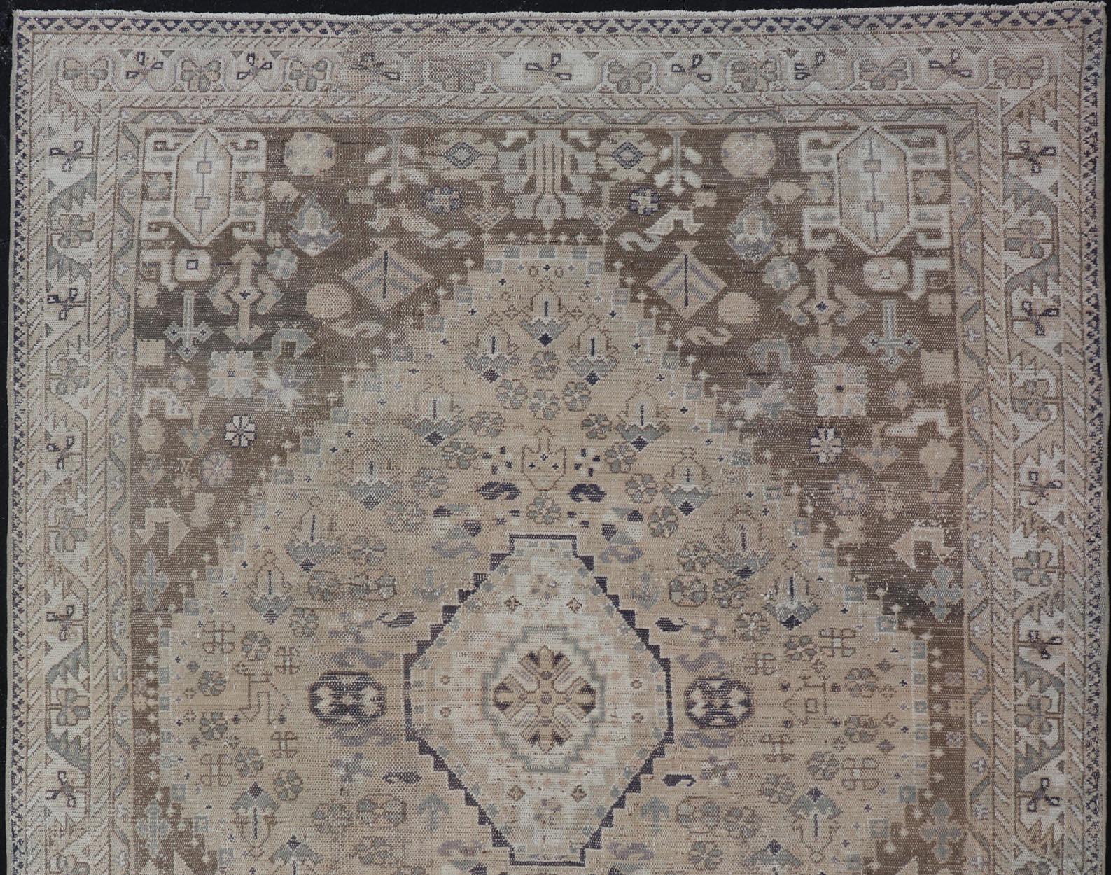 Brown/Taupe Antique Persian Shiraz rug with Vertical Sub-Geometric Medallion, rug EMB-9631-P13525, Keivan Woven Arts / country of origin / type: Iran / Shiraz, circa 1930

Measures: 5'5 x 7'5.