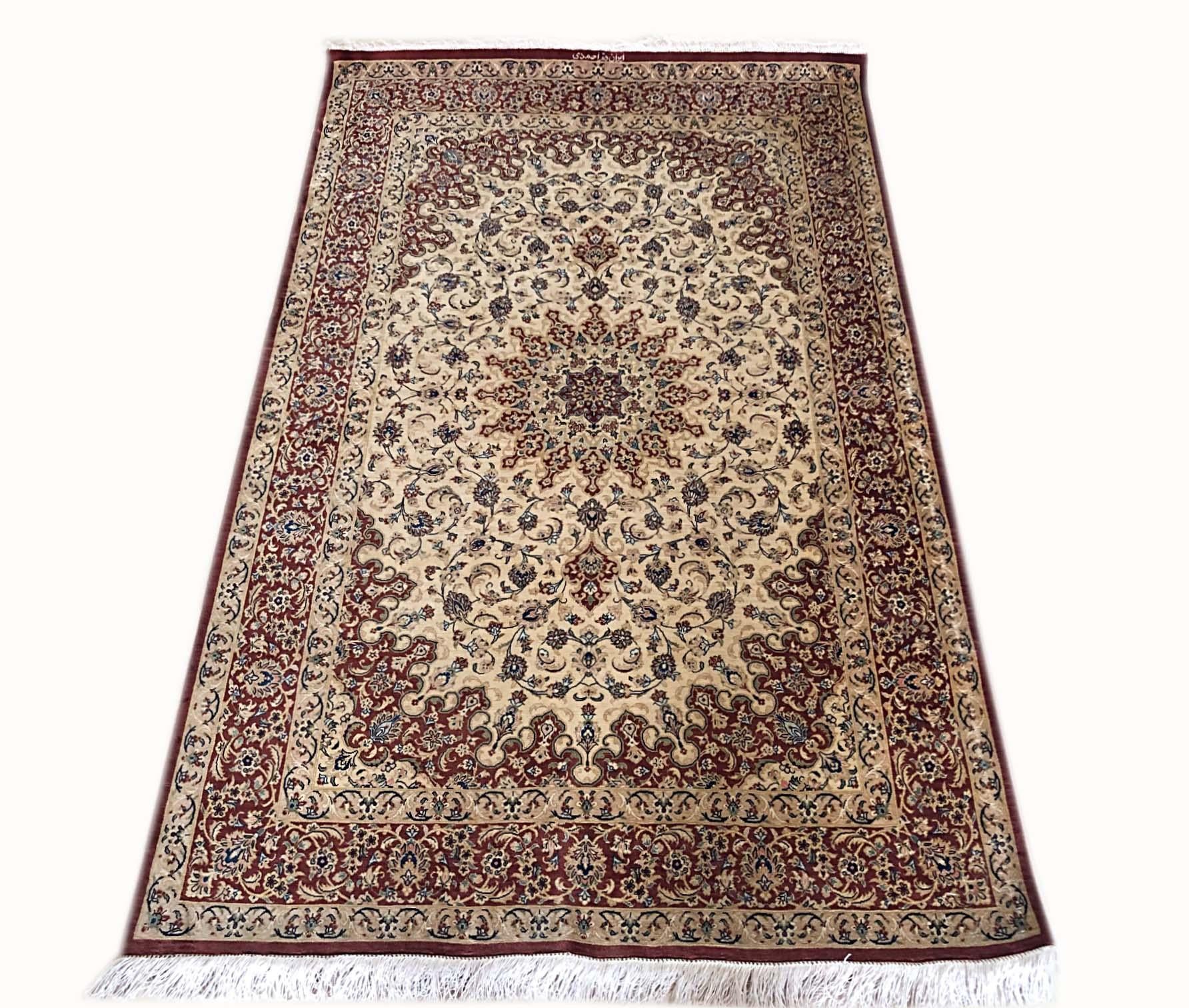 This authentic Persian Qum rug has silk pile and silk foundation with excellent condition. The color combination in this rug is absolutely outstanding. The base color is cream and the border is rust. The design in this piece is medallion floral.