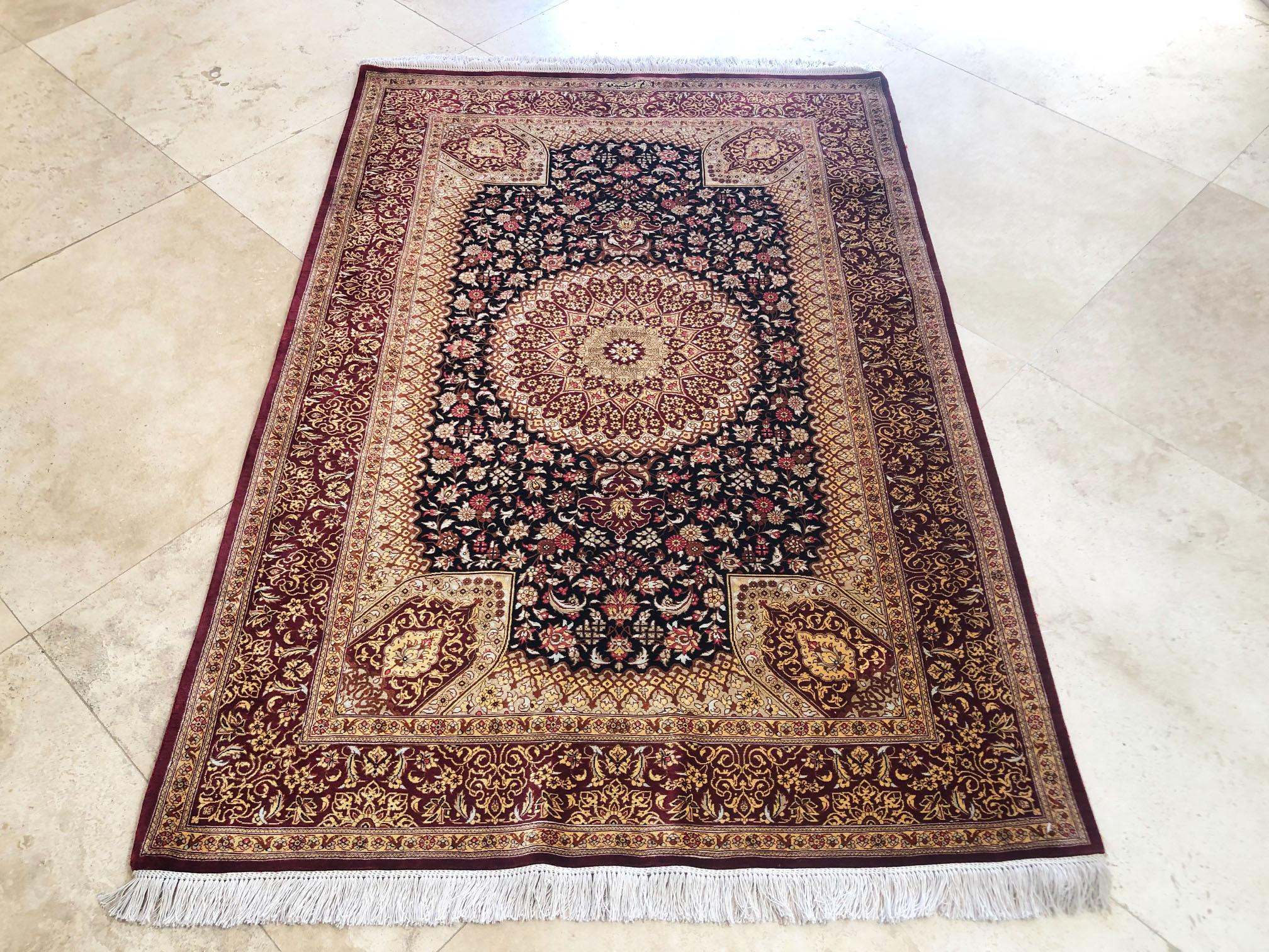 This authentic rug is from Qum, Iran which has been a rug weaving center in the past 100 years with high quality and expensive handmade rug. This stunning piece has silk pile and silk foundation. The color combination in this rug is absolutely
