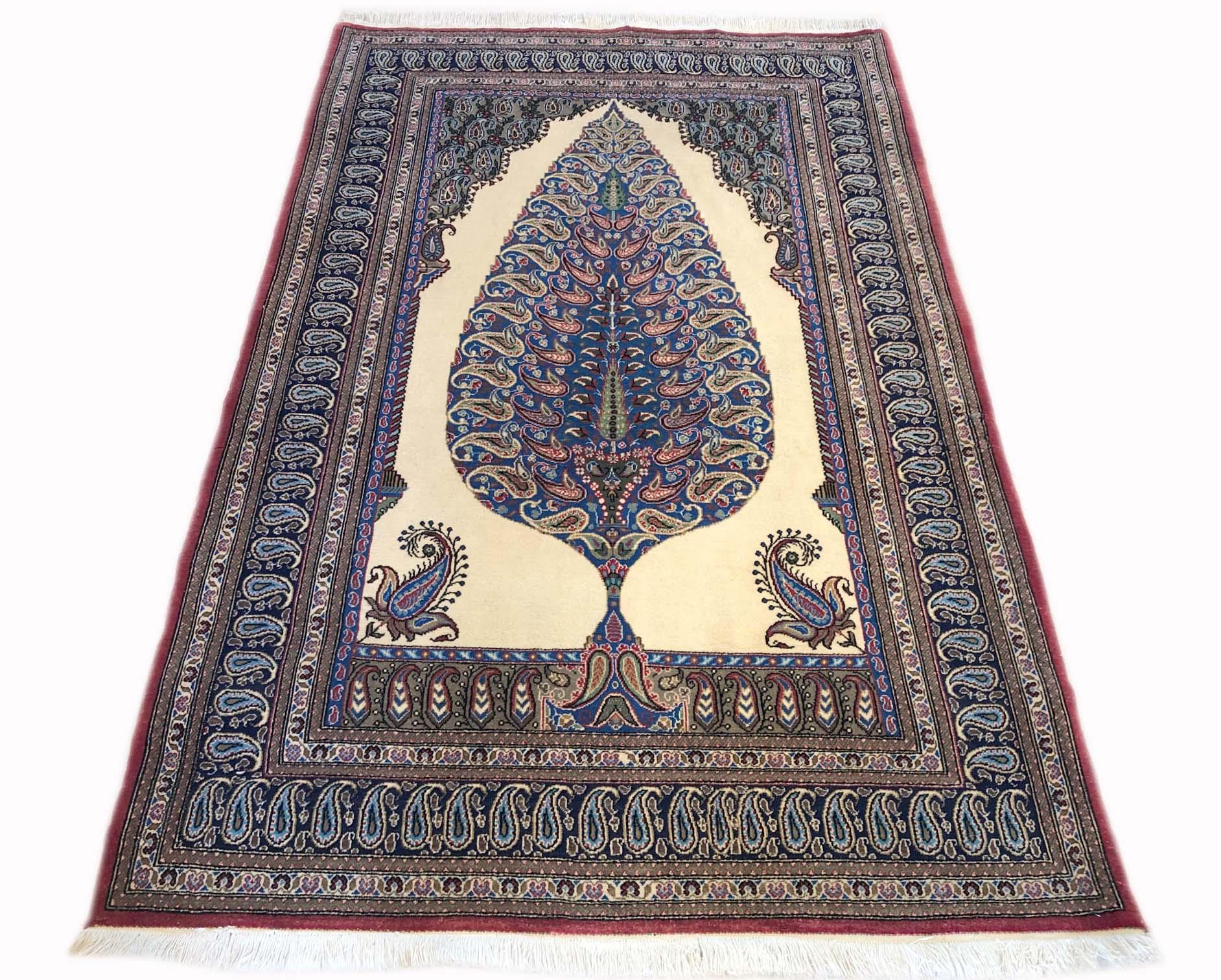 This beautiful Persian Qum rug has wool pile with cotton foundation. The size is 3 feet 5 inch by 5 feet 1 inches. The design is tree of life which is a popular element in many vintage Persian rugs, and is one of the oldest symbols found in rug