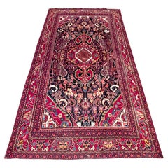 Tapis persan Bakhtiari à médaillon tribal bleu rouge, noué à la main, vers 1960