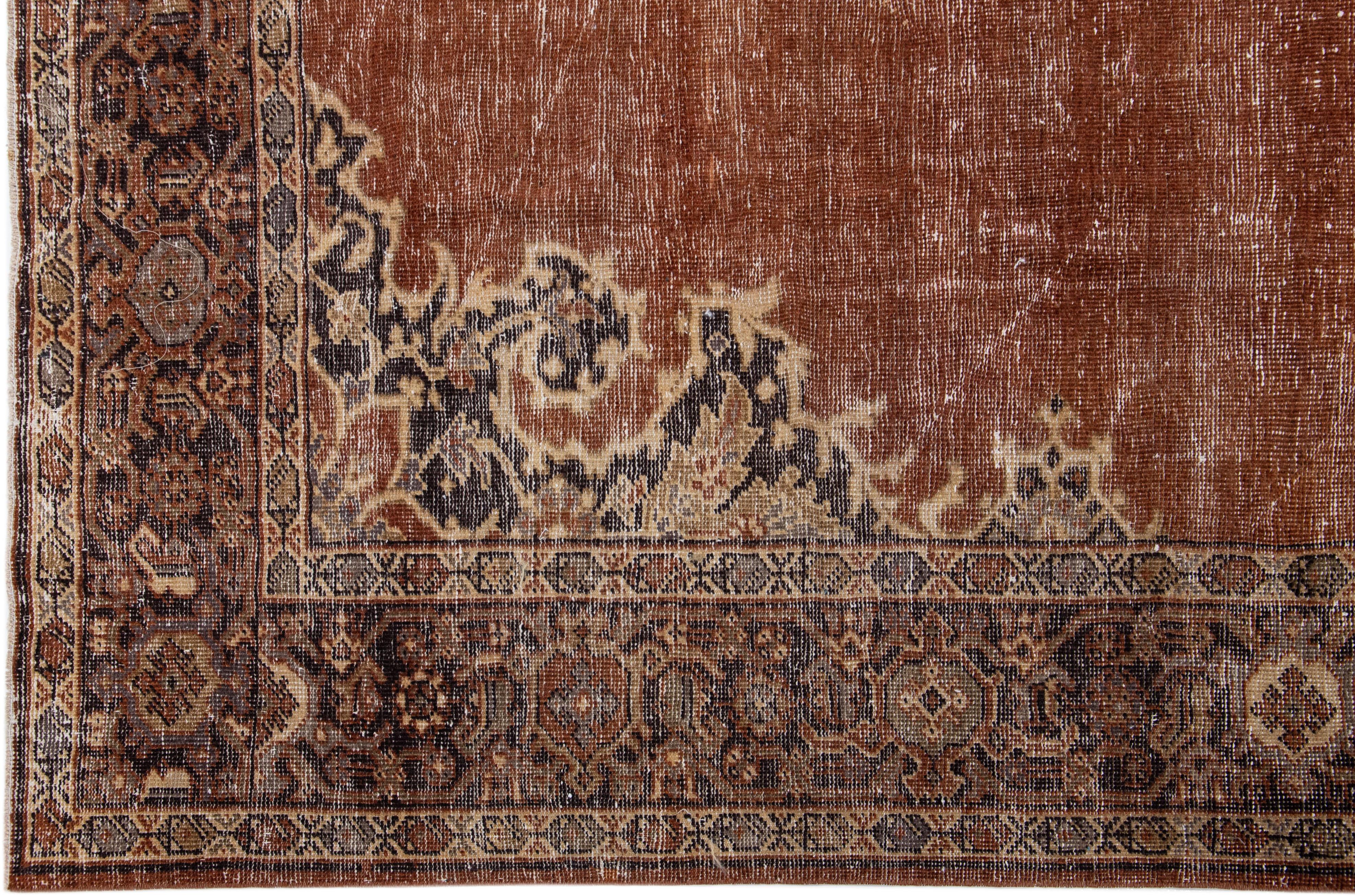 20th Century Persian Handmade Antique Tabriz Medallion Wool Rug With Copper Color Field For Sale