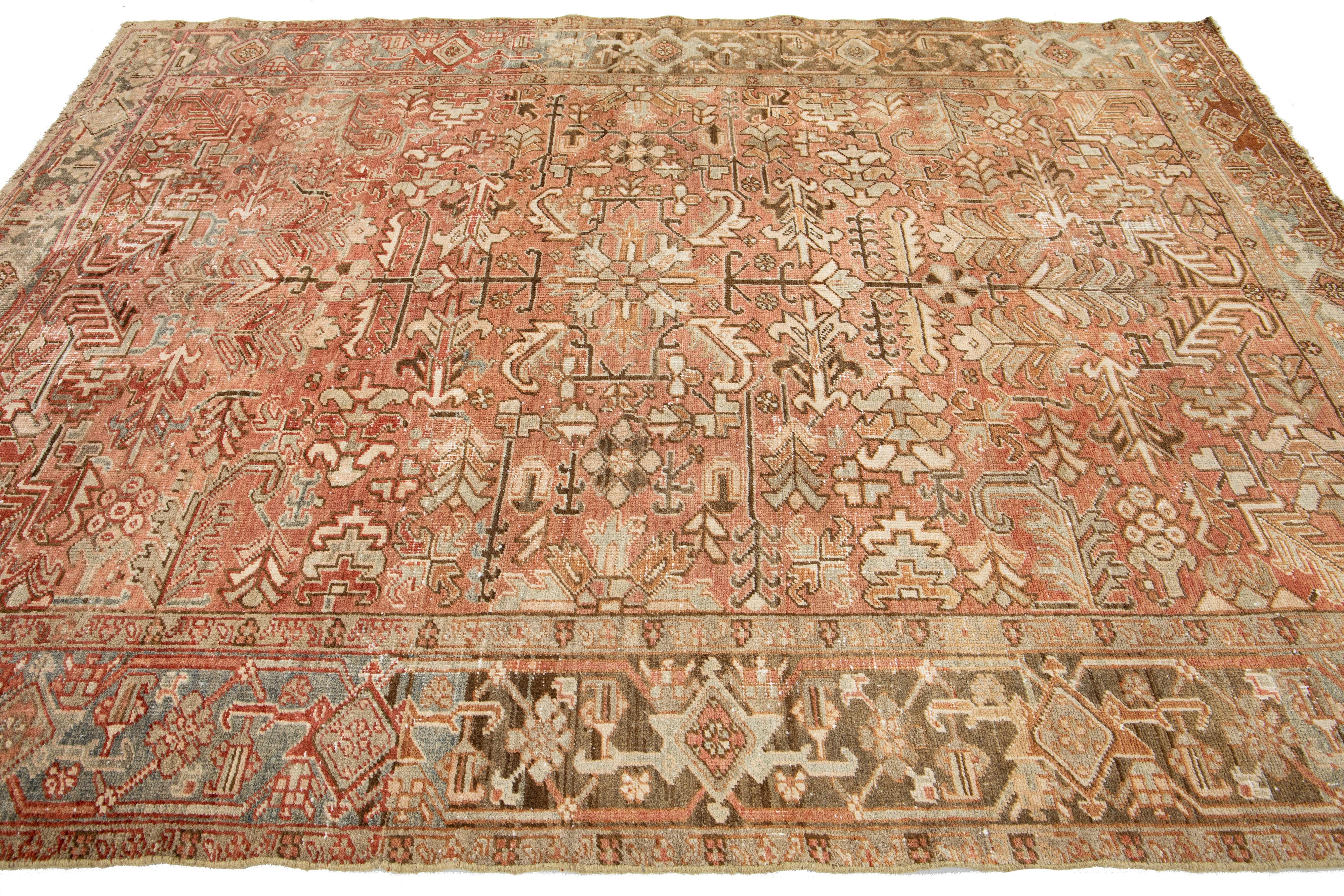 Early 20th Century Persian Heriz Antique Wool Rug In Peach Featuring a Allover Motif  For Sale