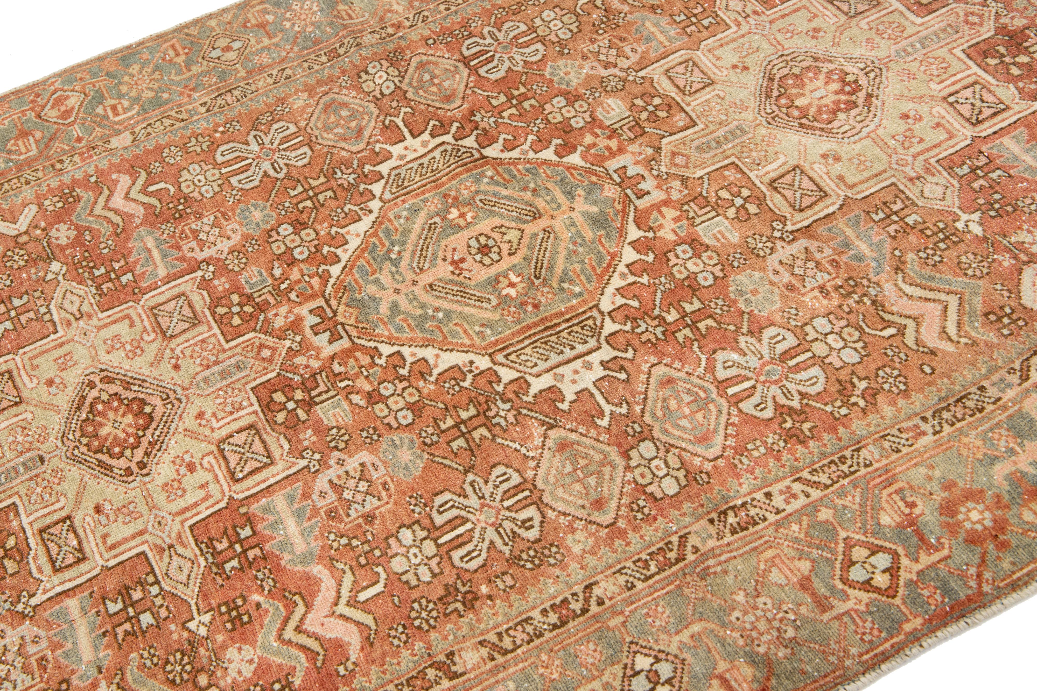 Heriz Serapi Persian Heriz Antique Wool Rug In Rust Color Featuring a Tribal Pattern For Sale