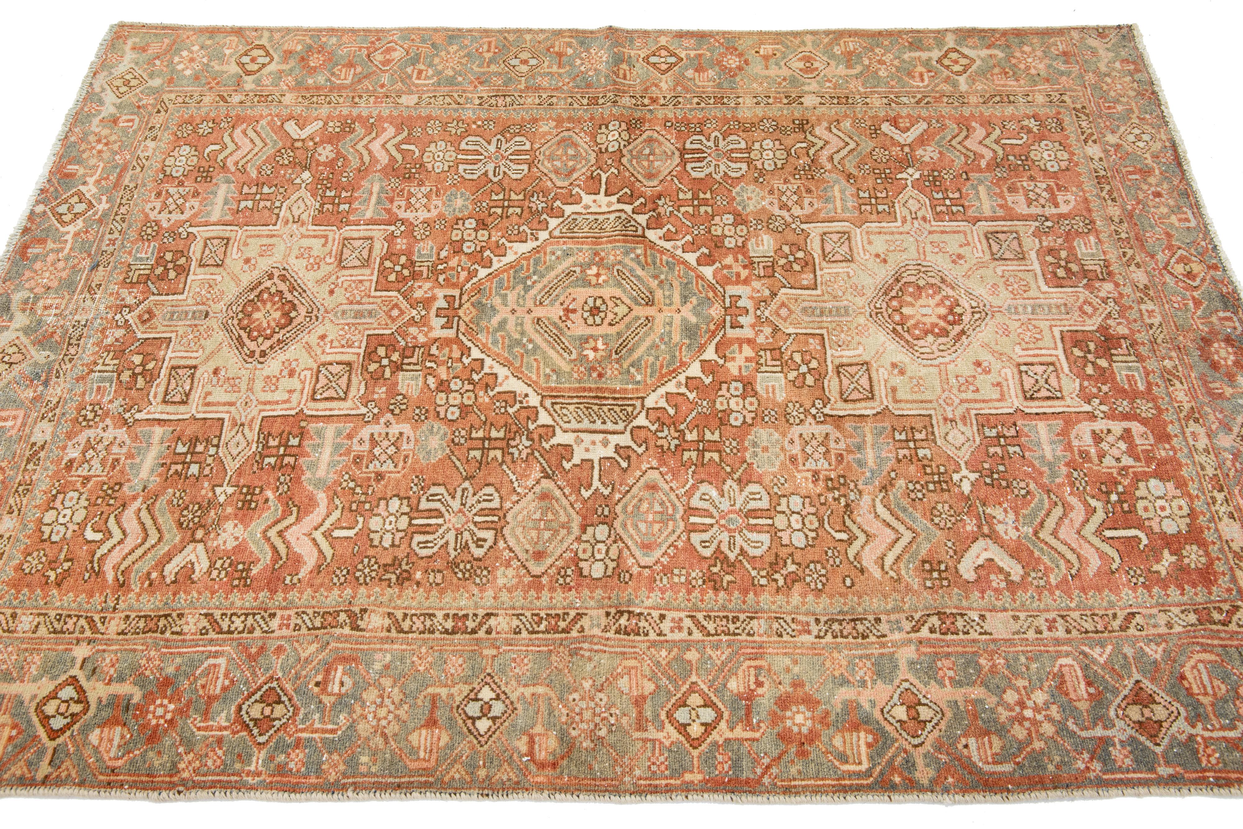 Hand-Knotted Persian Heriz Antique Wool Rug In Rust Color Featuring a Tribal Pattern For Sale