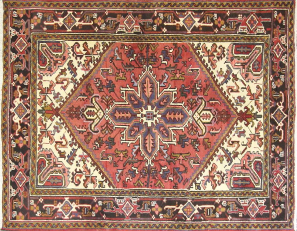Gorgeous Persian Heriz carpet with medallion design and red and blue background color. Heriz rugs are Persian rugs from the area of Heris, East Azerbaijan in northwest Iran, northeast of Tabriz. Such rugs are produced in the village of the same name