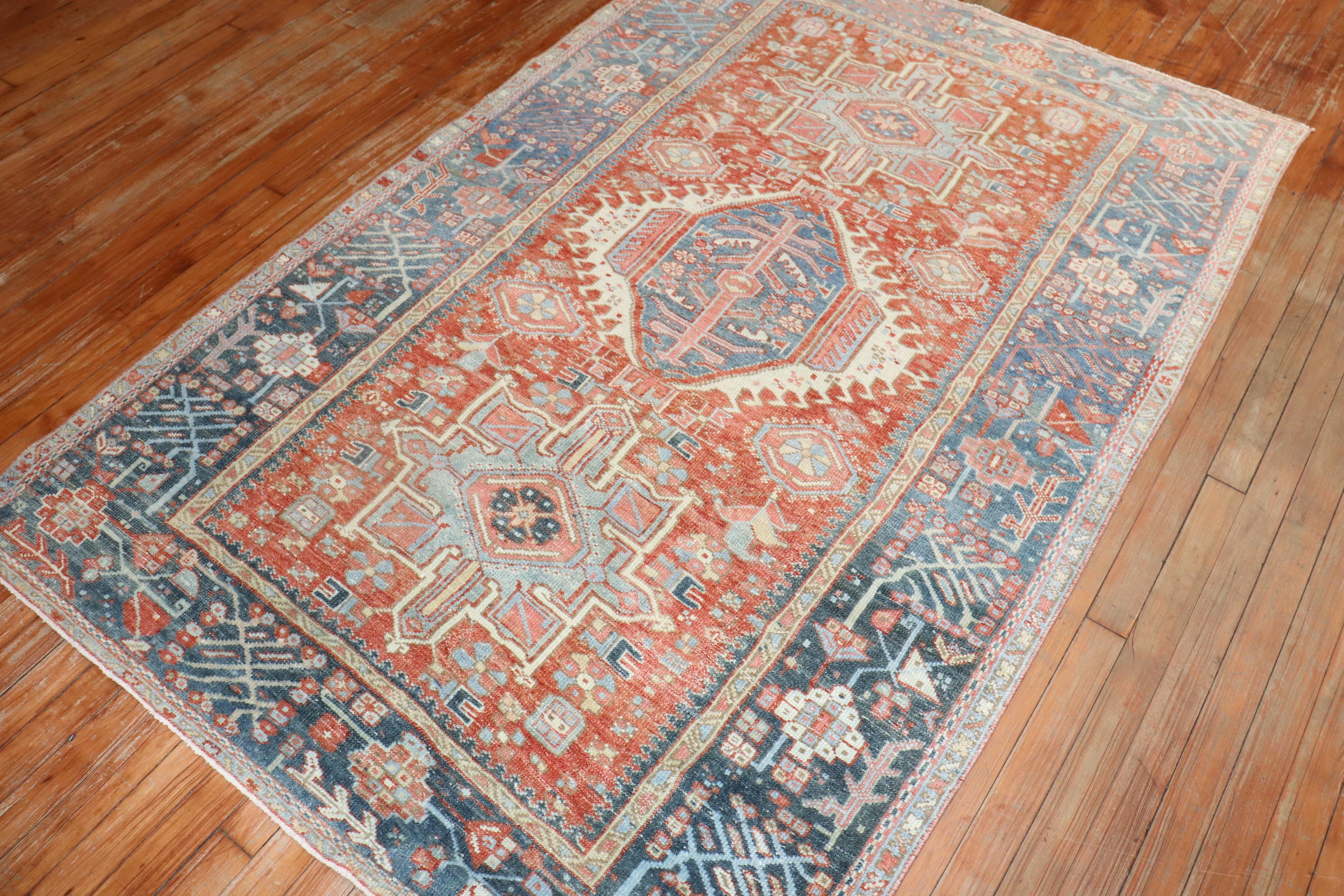 Classic early 20th century Persian Heriz Karadja rug in terracotta, blues and grays

Measures: 4'4'' x 6'7''.