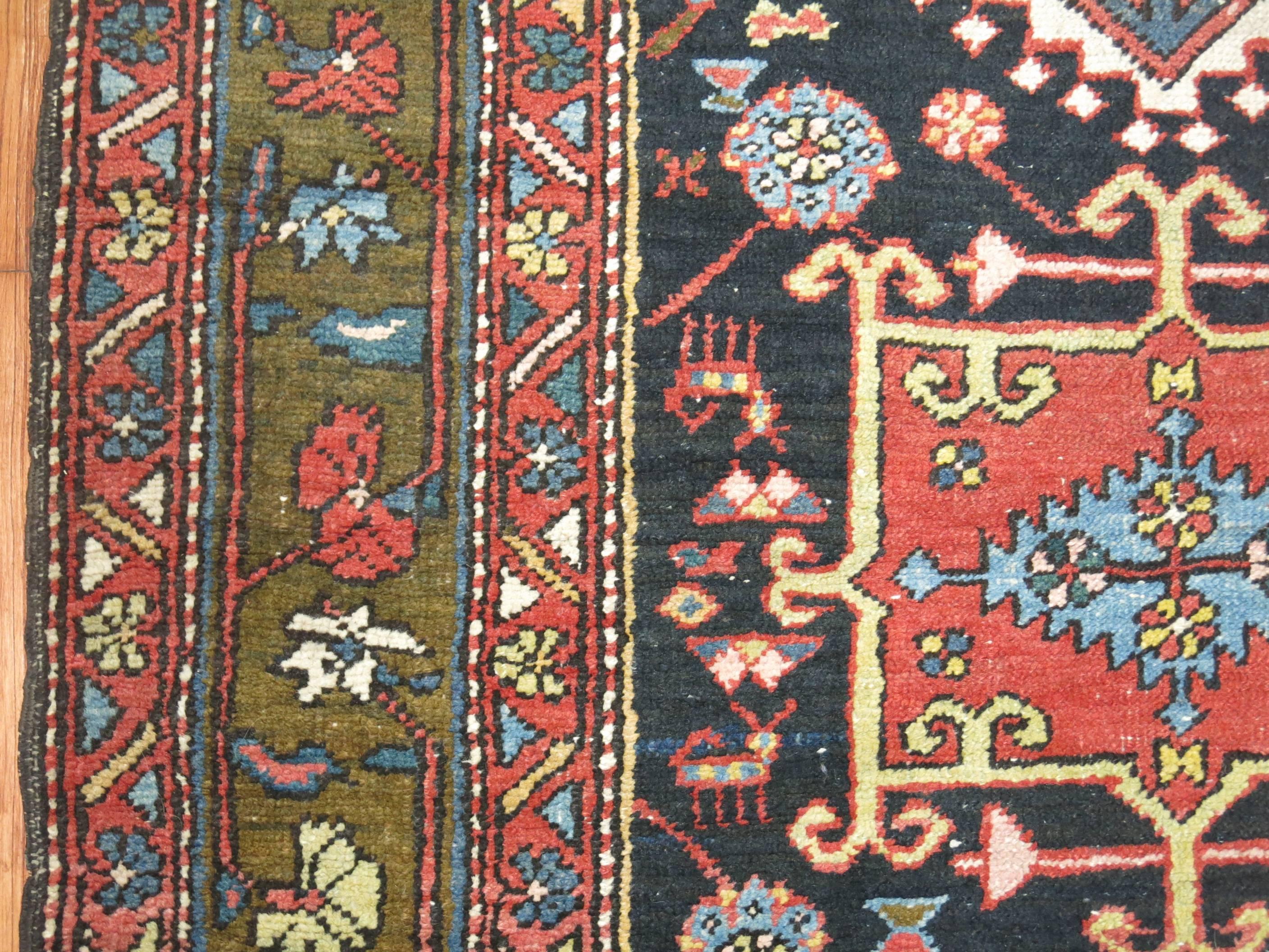 A rare Persian Heriz runner with a colorful all-over design.