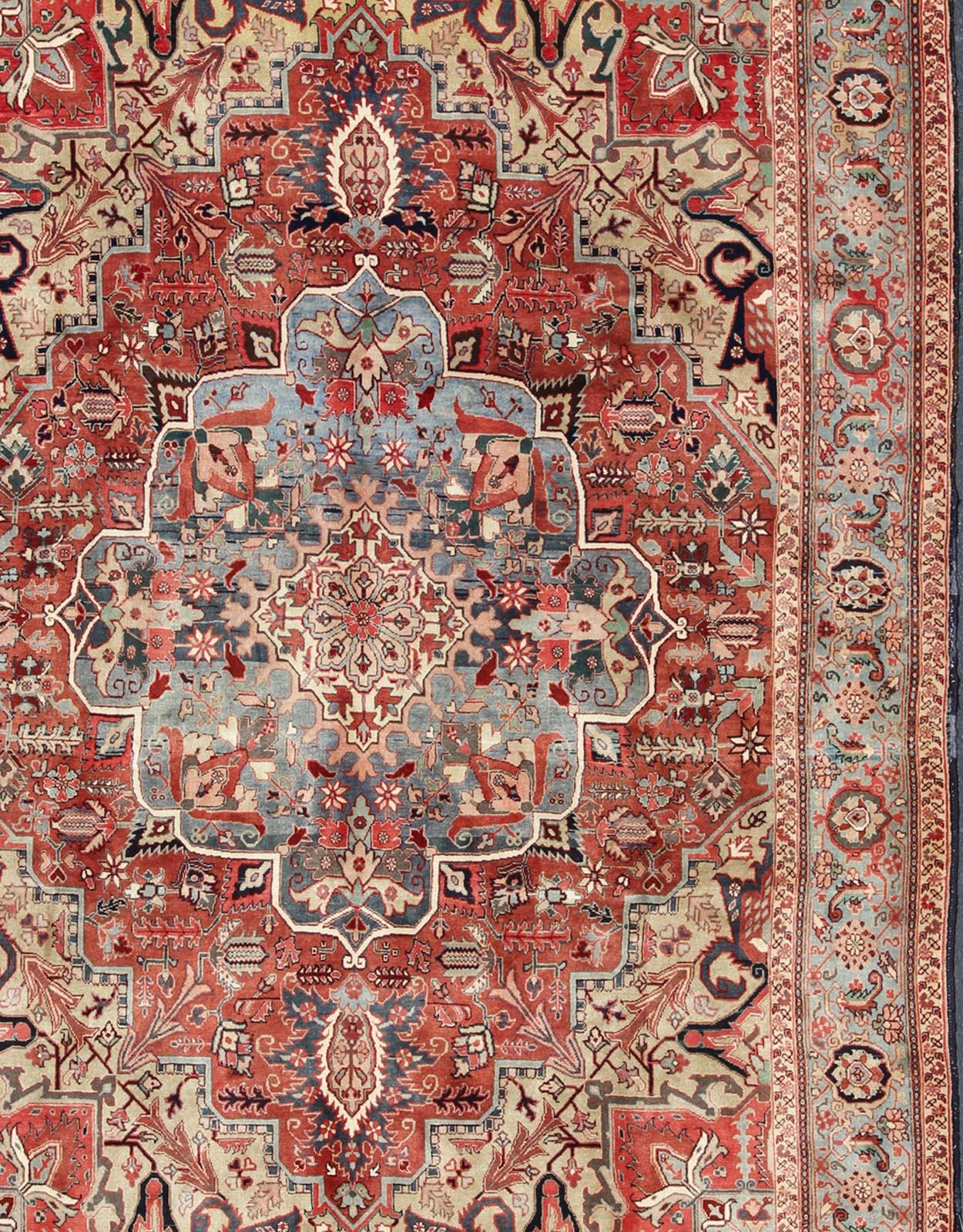 Large Heriz-Serapi Vintage Persian Rug with Geometric Design in Rust Red, Light Blue, yellow, and Multi colors. Keivan Woven Arts/ Rug/ BN, Country/type/ Persian Rug, Serapi Heriz

 Measures: 9'6 x 13'1 
 
In excellent condition, this exquisite