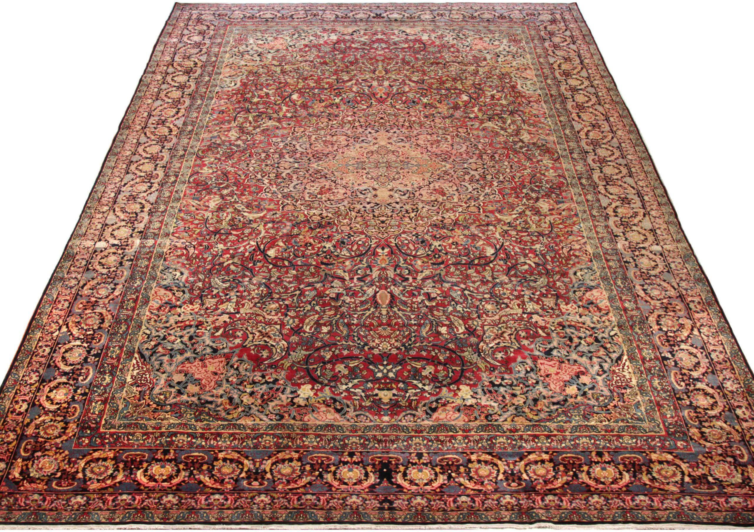 Entdecken Sie die Eleganz des persischen Isfahan-Teppichs in Übergröße aus der Zeit um 1910. Dieses exklusive Design aus Wolle und Blau-Elfenbein-Rot ist perfekt, um Ihren Raum zu verschönern.