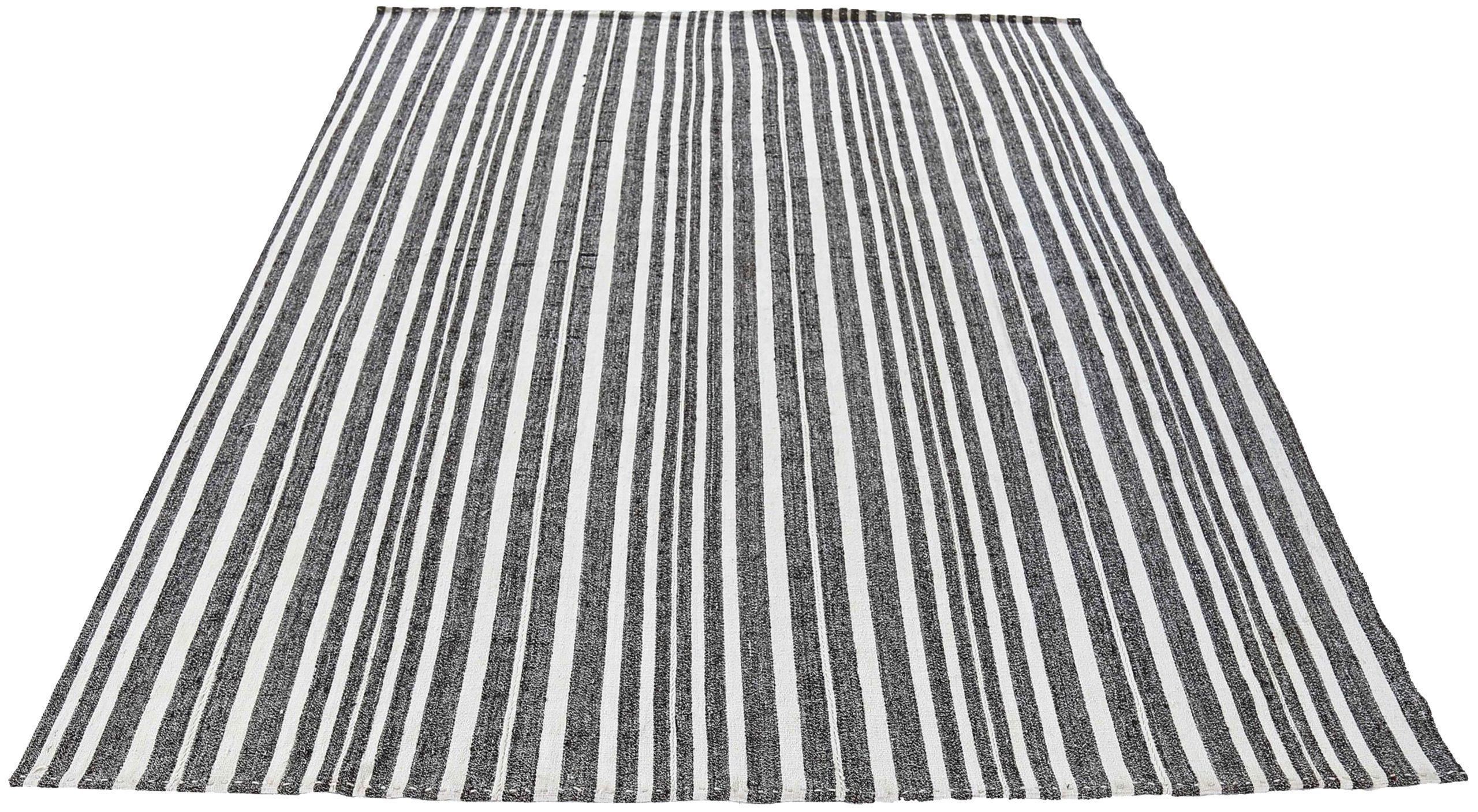 Discover the elegance of Persian Jajim featuring Small Rug in Circa 1910. Designed with Wool and Black and white, this exclusive design is perfect for enhancing your space.