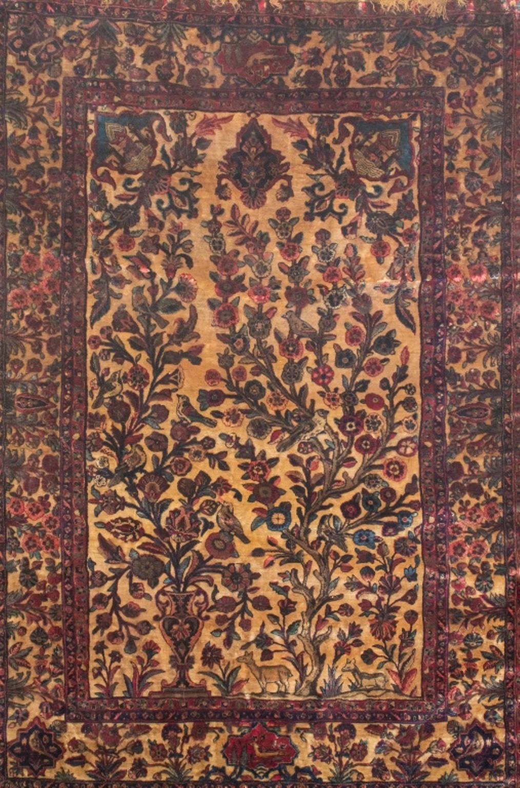 Persian Kashan antique silk pictorial rug, early 20th century, a flowering vase next to a tree with birds and deer on an ivory field, within a shrub and cartouche border. In very good vintage condition.

Dealer: S138XX