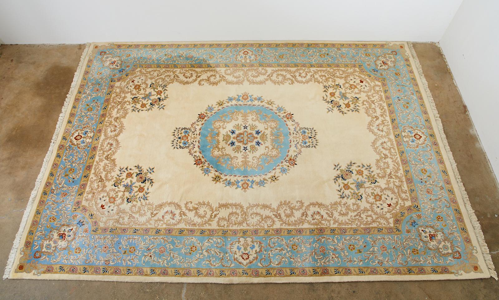 Exquisite Indo Kerman rug featuring a rare turquoise blue over a cream background. Hand-knotted with a soft wool pile and a cotton foundation. Elegant rug made with a deep full high pile.
   
