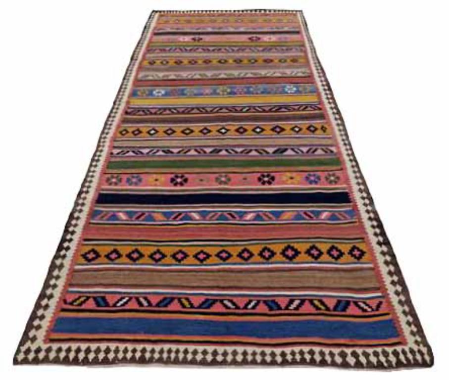 Discover the elegance of Persian Kilim featuring Area Rugs in Circa 1910. Designed with Wool and BlueGreenPinkYellow, this exclusive design is perfect for enhancing your space.